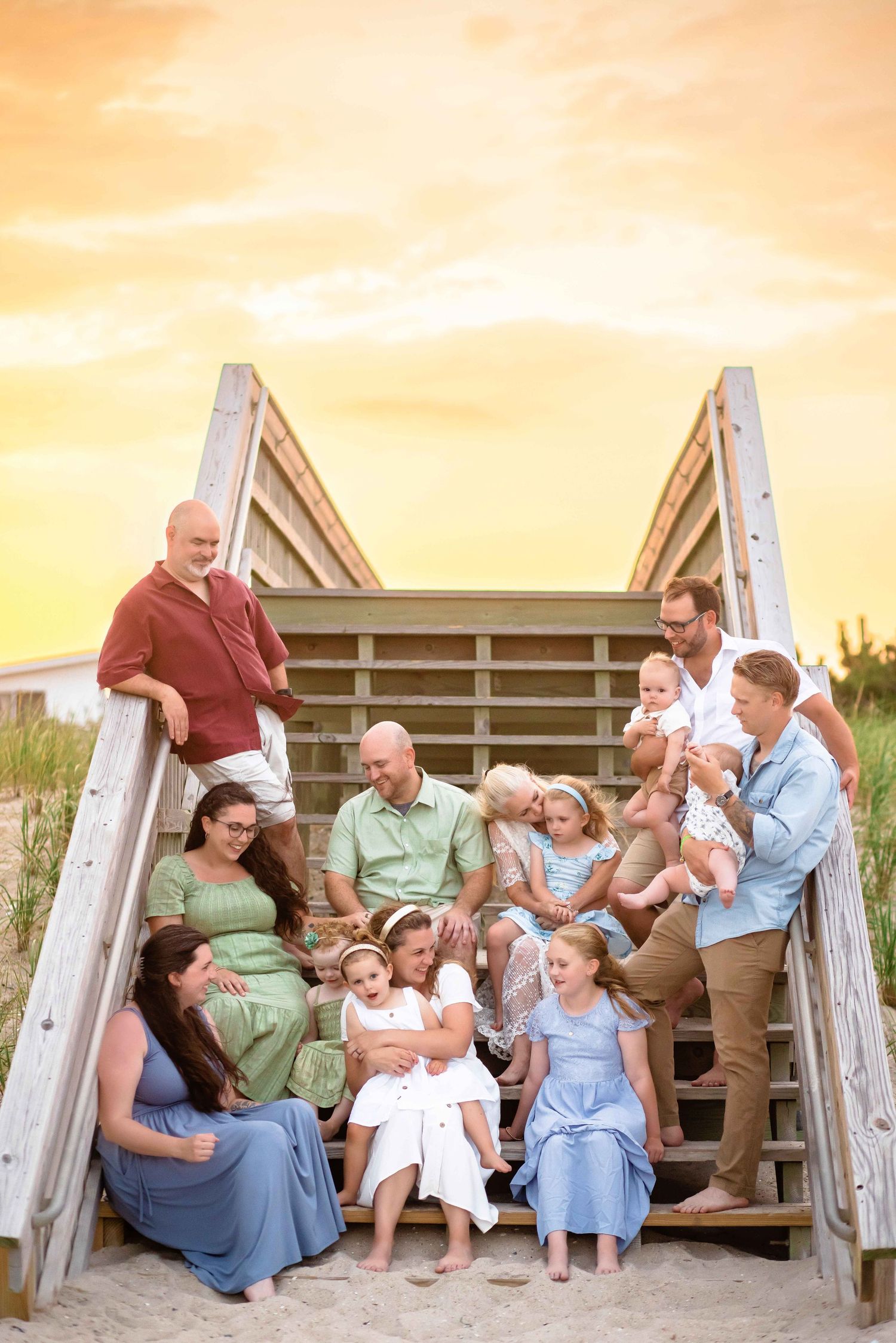 A candid photo series of a family sitting together on wooden stairs during sunset, showing natural interactions and laughter.