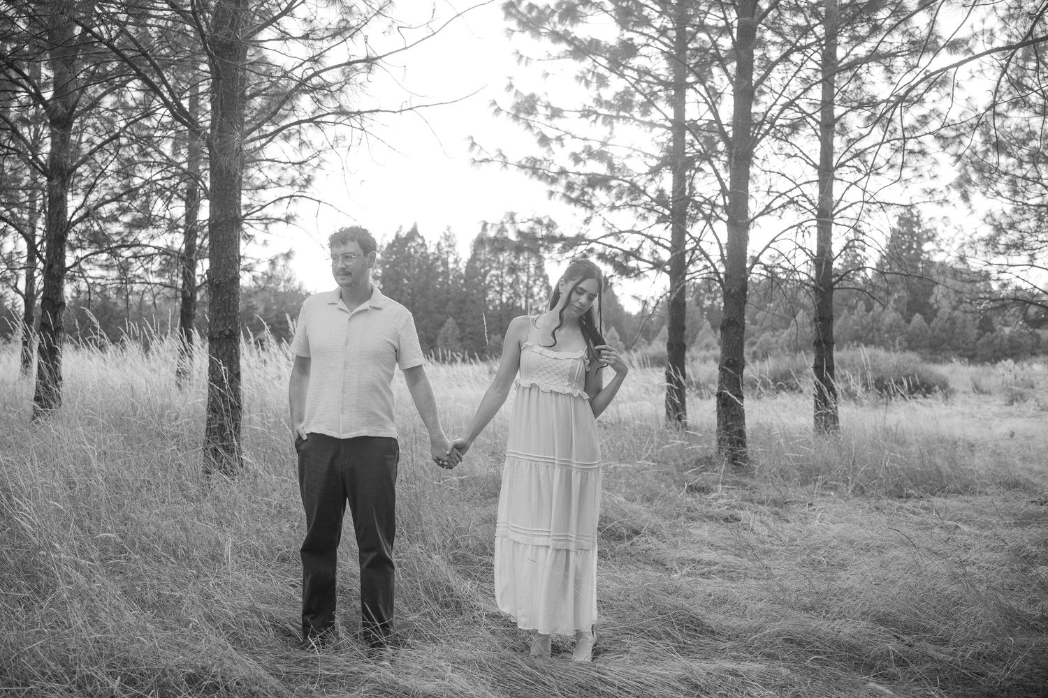 Series of romantic portraits in a pine forest with golden sunlight filtering through the trees.