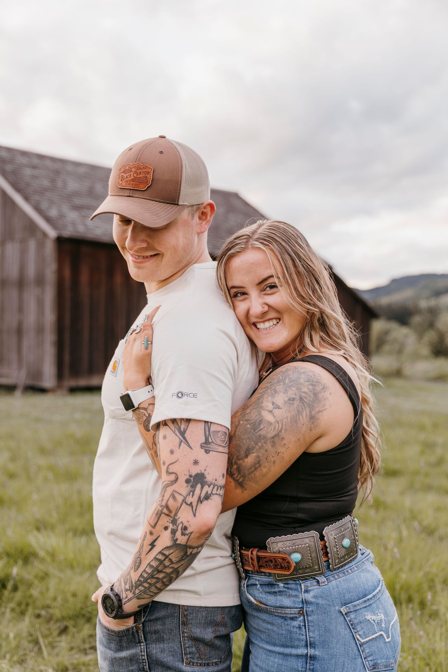 Casual outdoor portraits with rustic barn backdrop and vintage denim style.