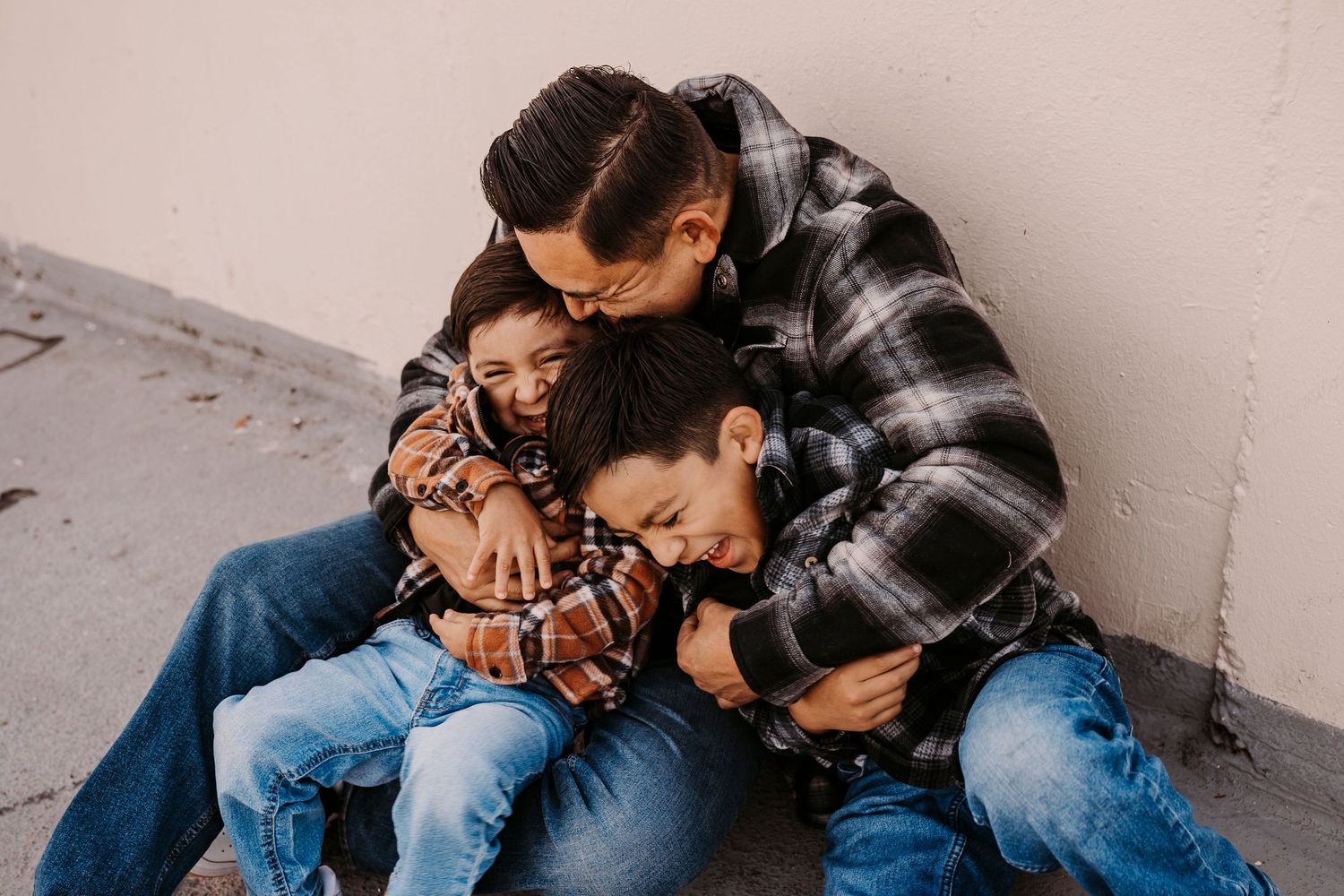 A casual family photoshoot showing playful moments and laughter.