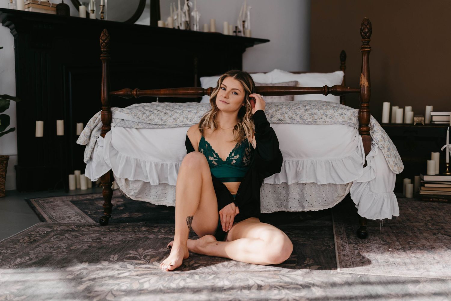Romantic boudoir photography session in bedroom with natural lighting.