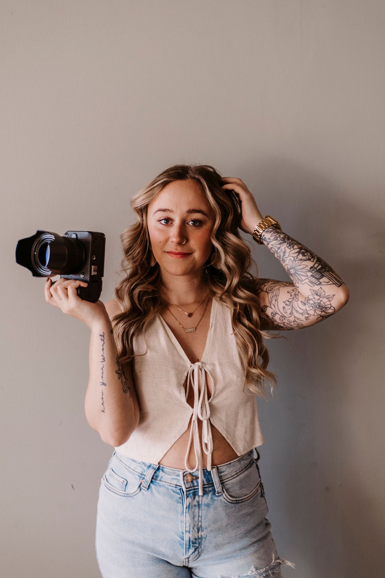 Series of casual portraits showing photographer with camera and tattoos.