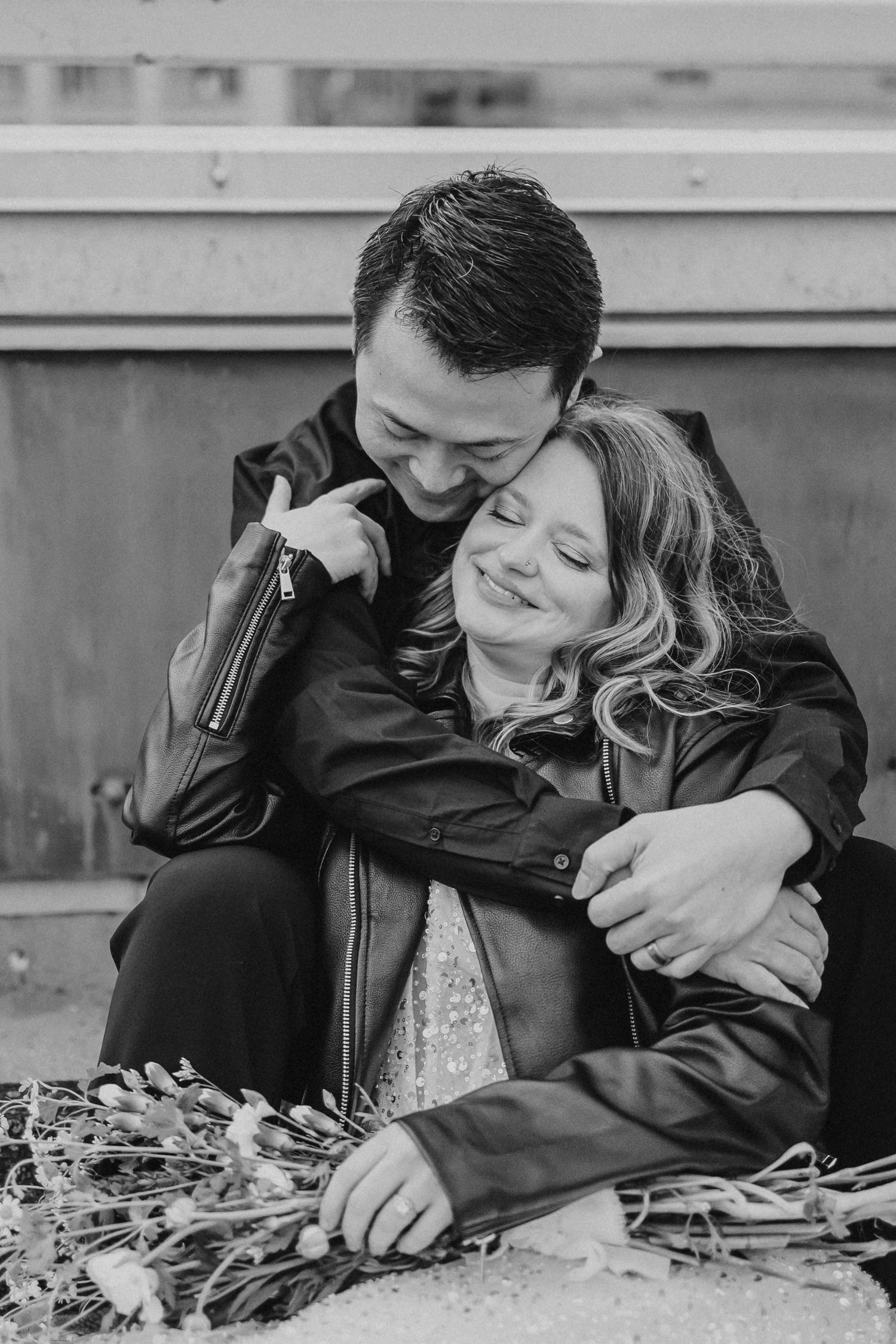 Black and white intimate portraits of couple sharing tender moments.
