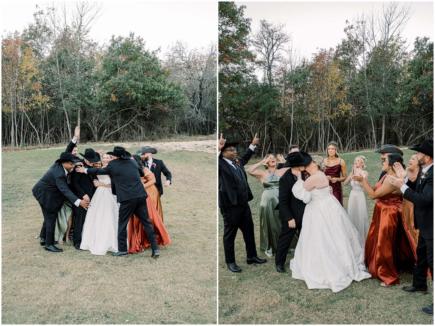 A wedding party in formal attire gathers together for a playful group moment on a grassy field near trees.