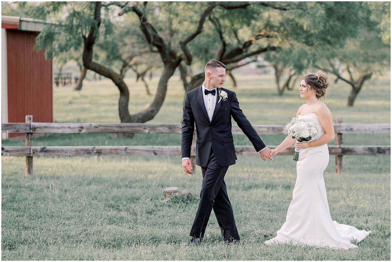 Elegant outdoor wedding photography session with rustic barn and natural landscape.