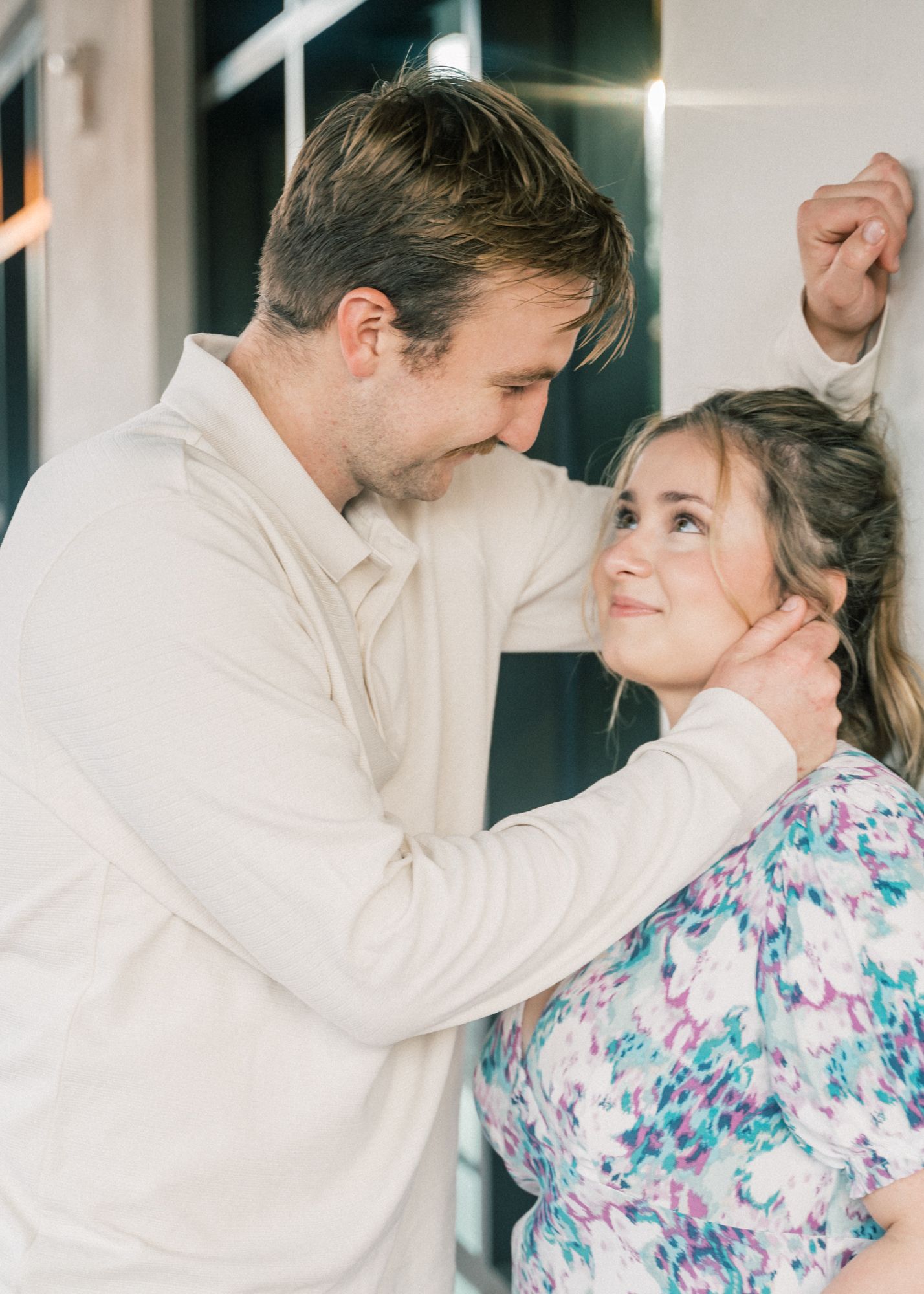 A series of candid dance poses showing a couple in white and floral attire performing together.