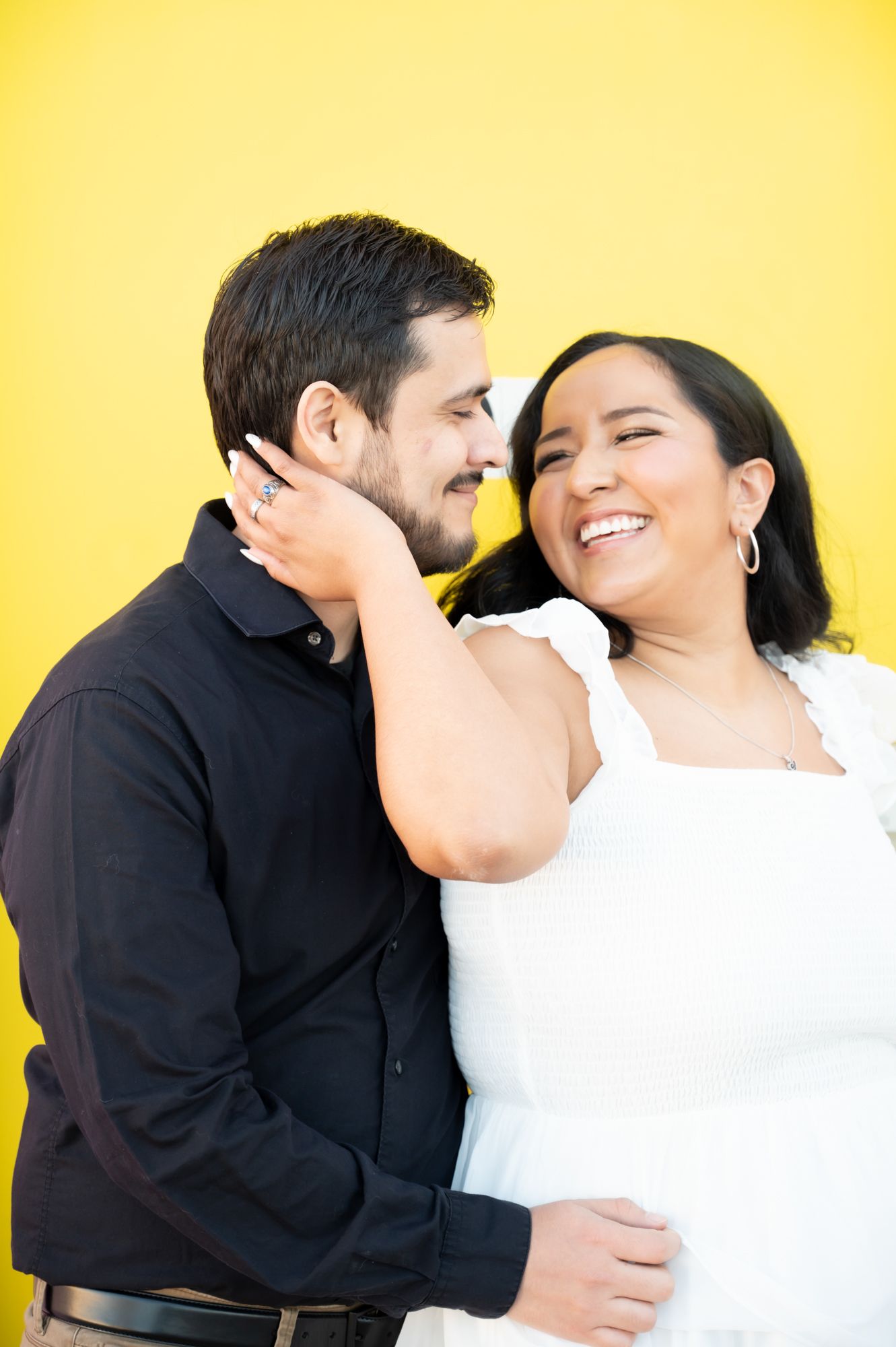 A romantic couple shares intimate moments against a bright yellow background.