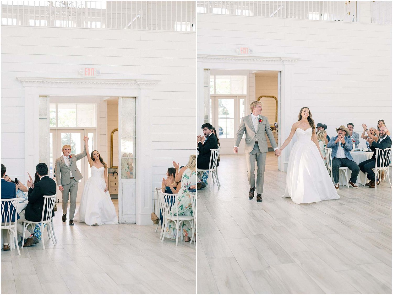 Bride and groom make grand entrance at elegant white wedding reception venue, holding hands and raising arms in celebration.