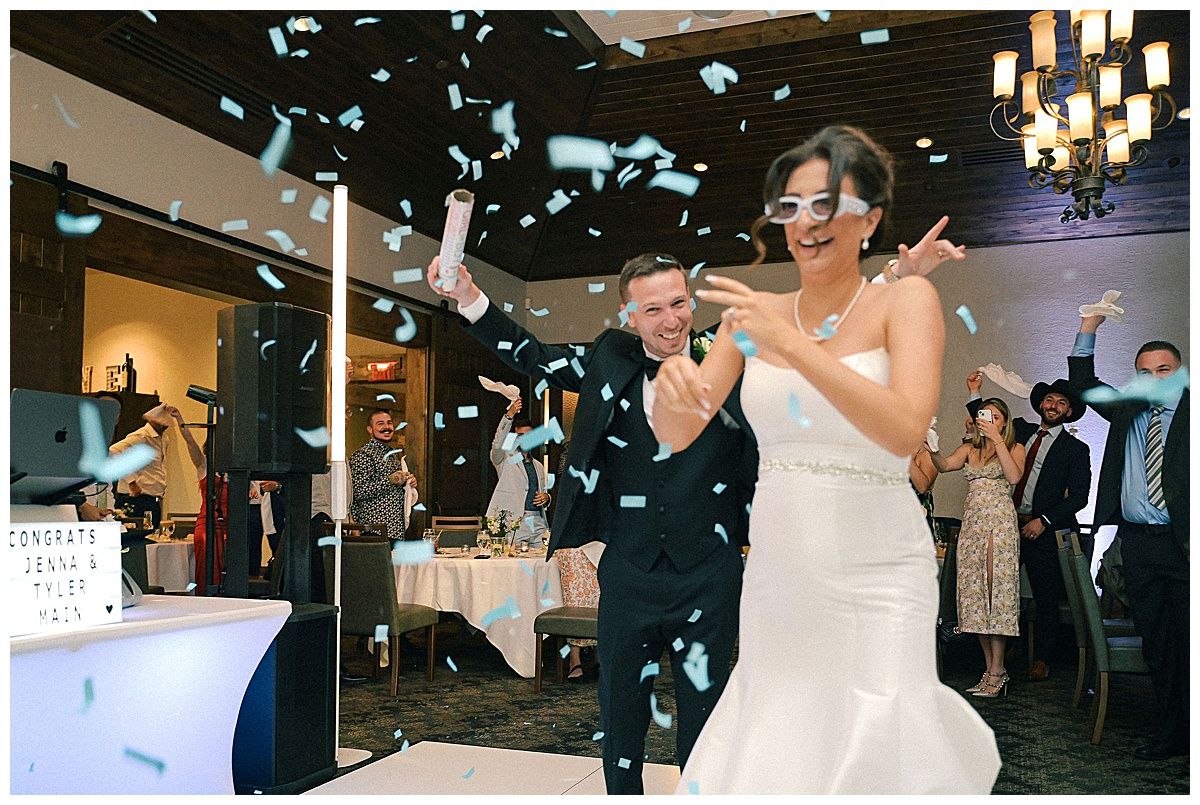 Wedding celebration with confetti falling during indoor reception dance.