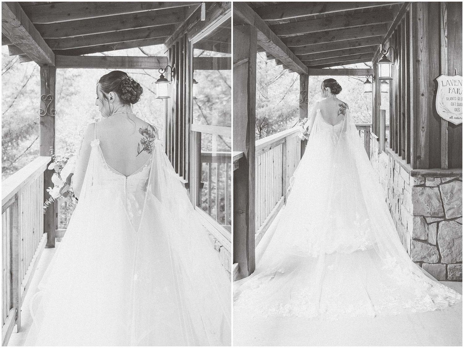 A bride in a flowing white wedding gown walks along a covered stone porch with dramatic lighting and shadows.