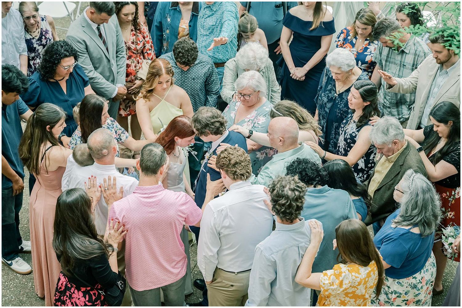 Wedding reception gathering with guests in formal attire.