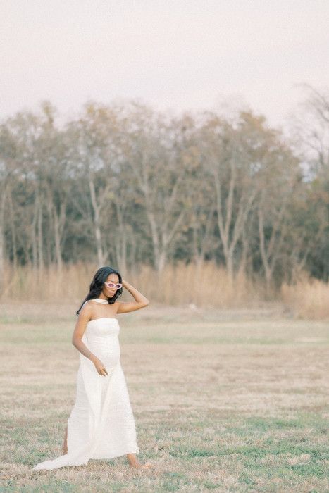 Artistic movement photography with flowing white fabric in a serene outdoor setting.