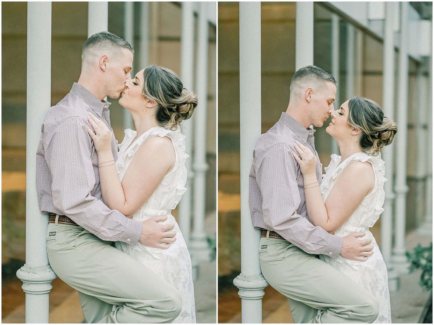 A couple embraces in front of white columns during an intimate outdoor photoshoot in soft lighting.