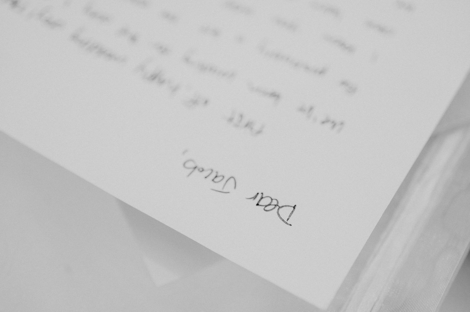 Close-up of wedding invitation text details in elegant typography.