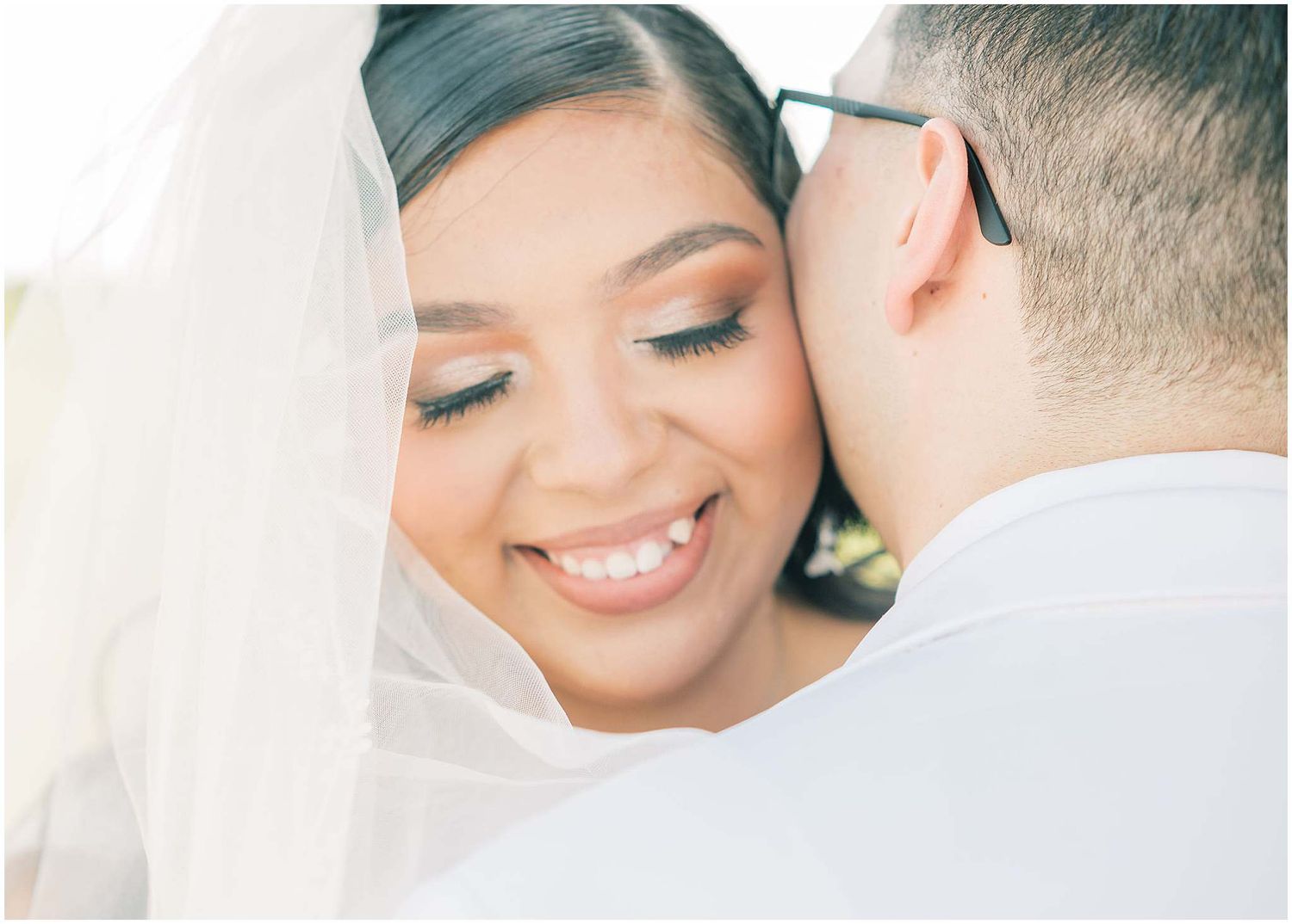 Intimate wedding portraits captured in soft, romantic lighting with delicate details.