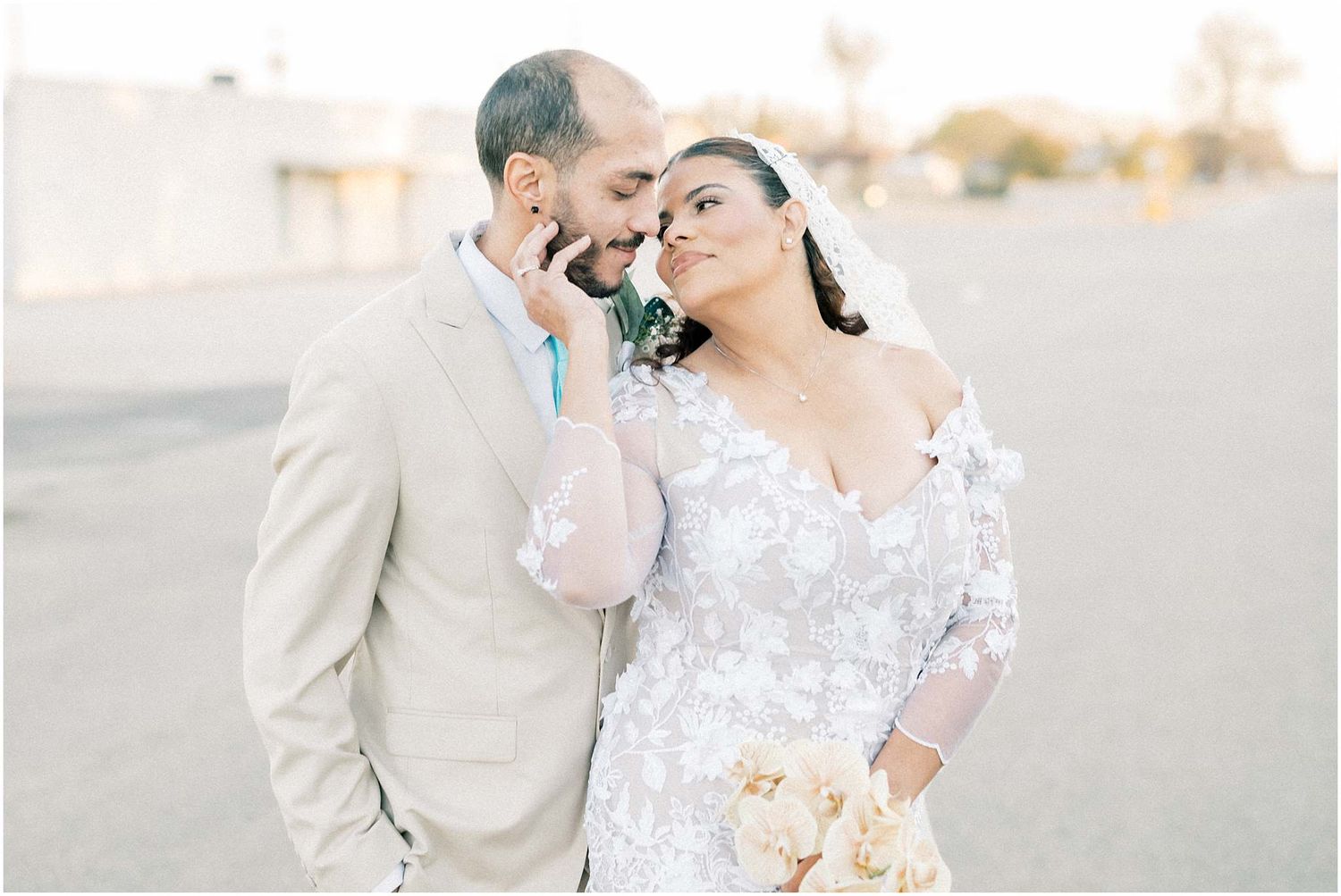 Intimate wedding portrait with soft lighting and delicate lace details.