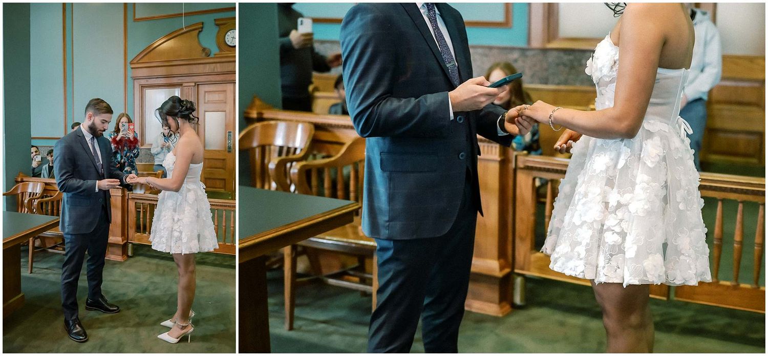 Wedding party members in formal attire gathered in a church hallway with wooden paneled walls.