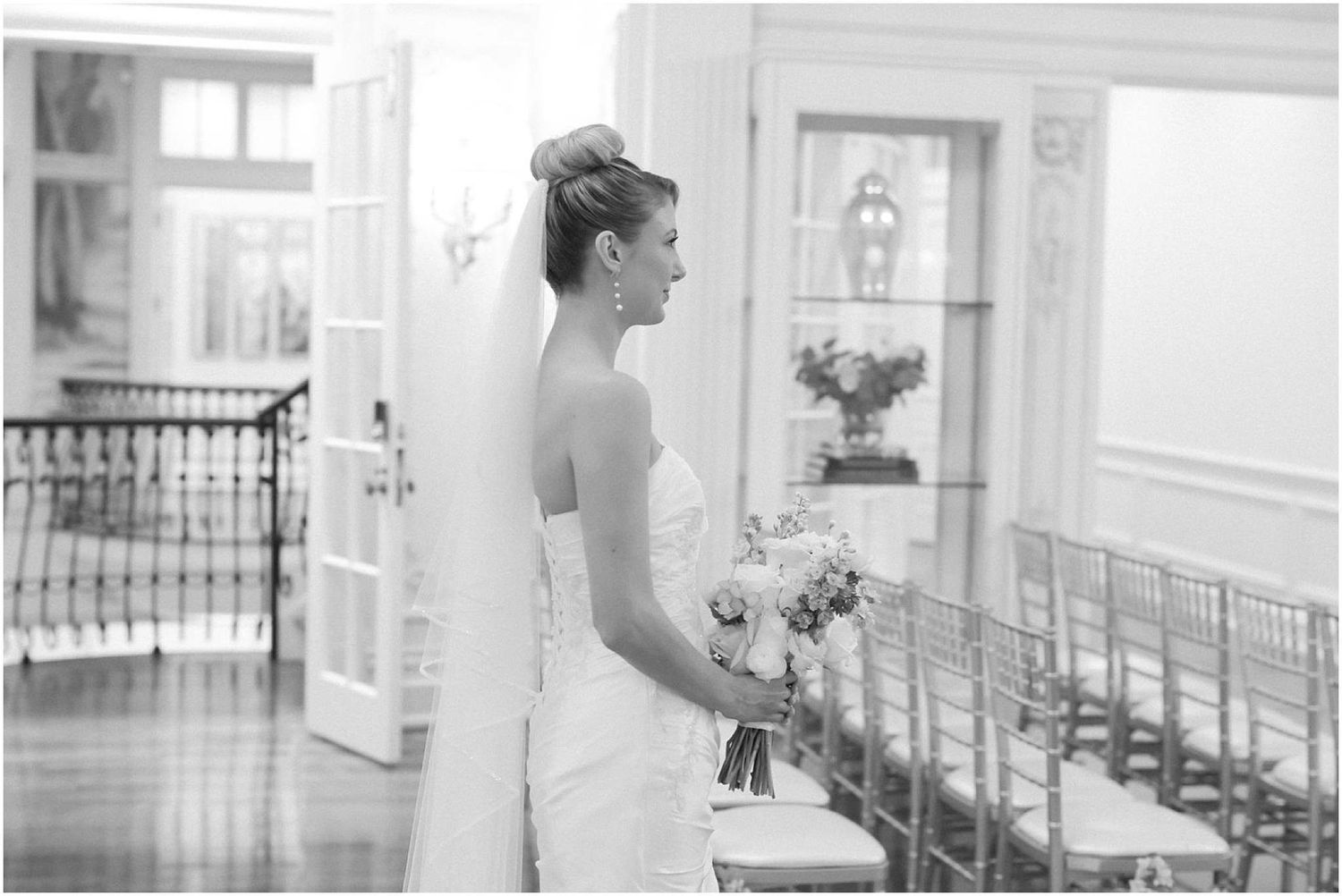 Classic bridal portraits captured in an elegant white interior with natural lighting.