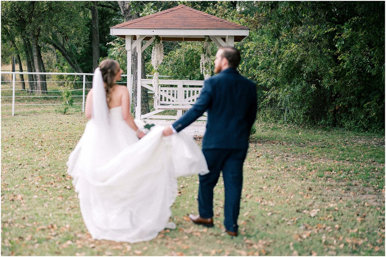 Wedding couple shares intimate moments in an outdoor garden setting with natural lighting.
