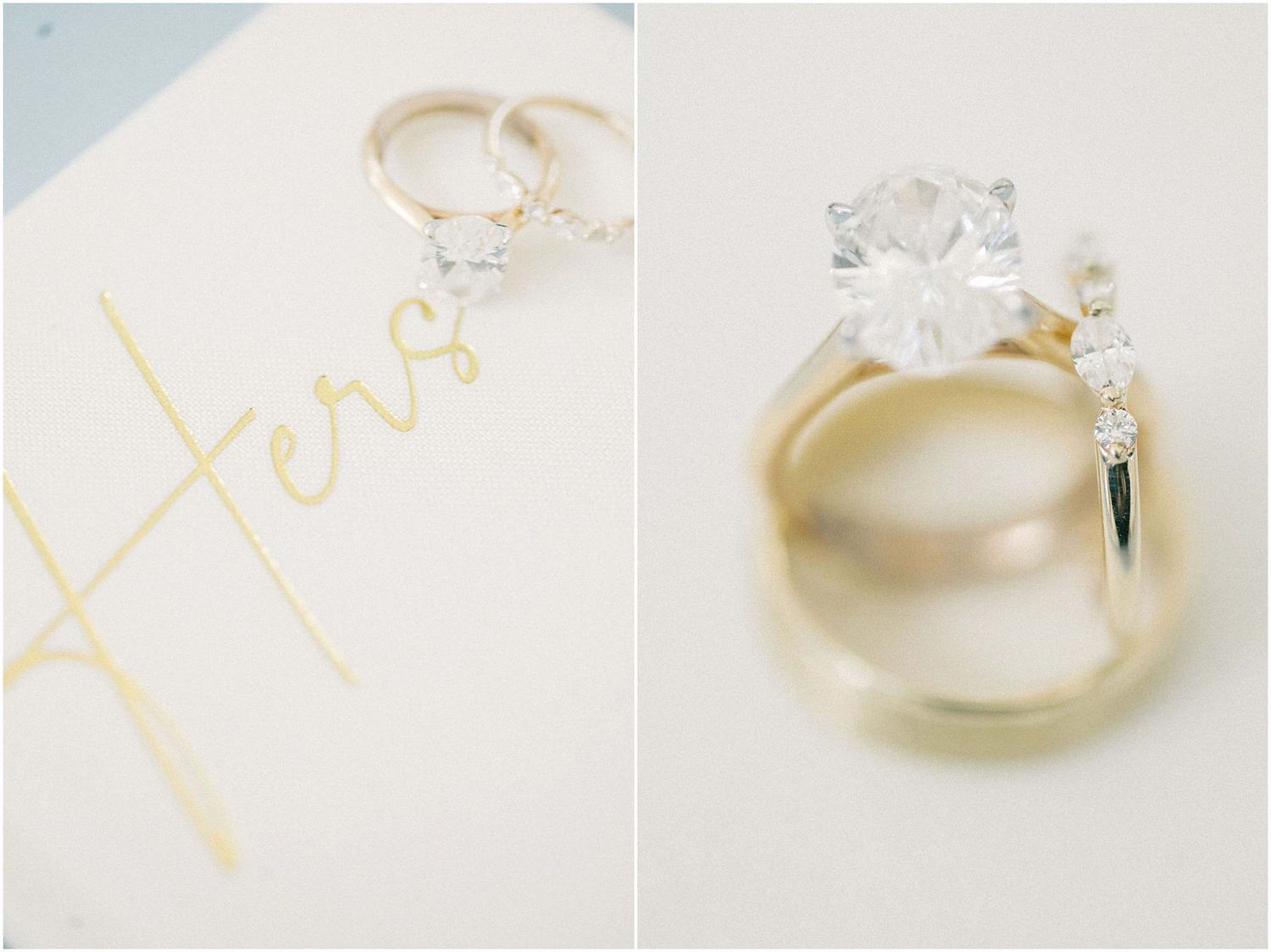 Gold wedding bands and a diamond engagement ring rest on a white card with gold script lettering spelling Hers.