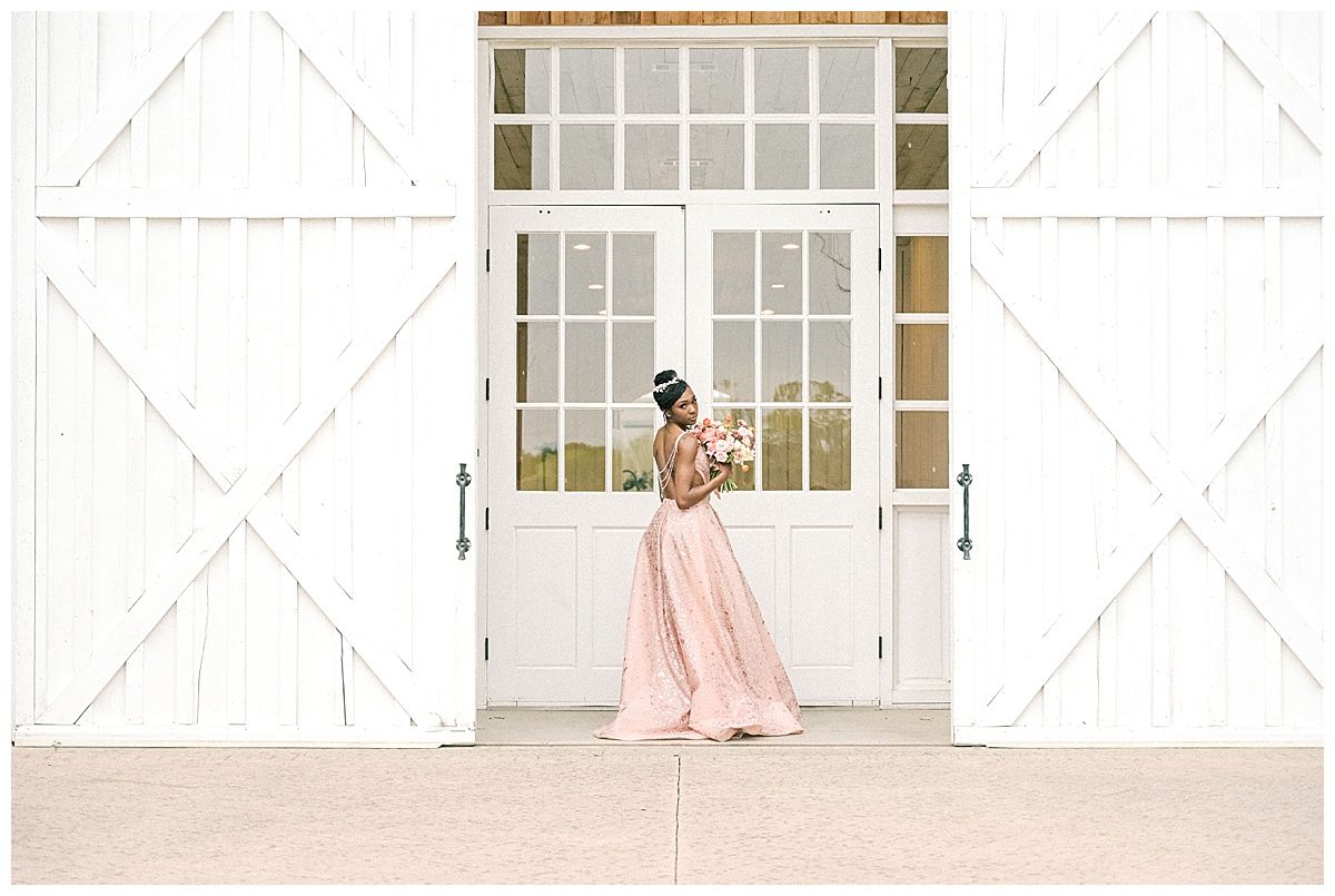 A series of elegant wedding photos showing a pink gown against white barn doors and windows in rustic settings.