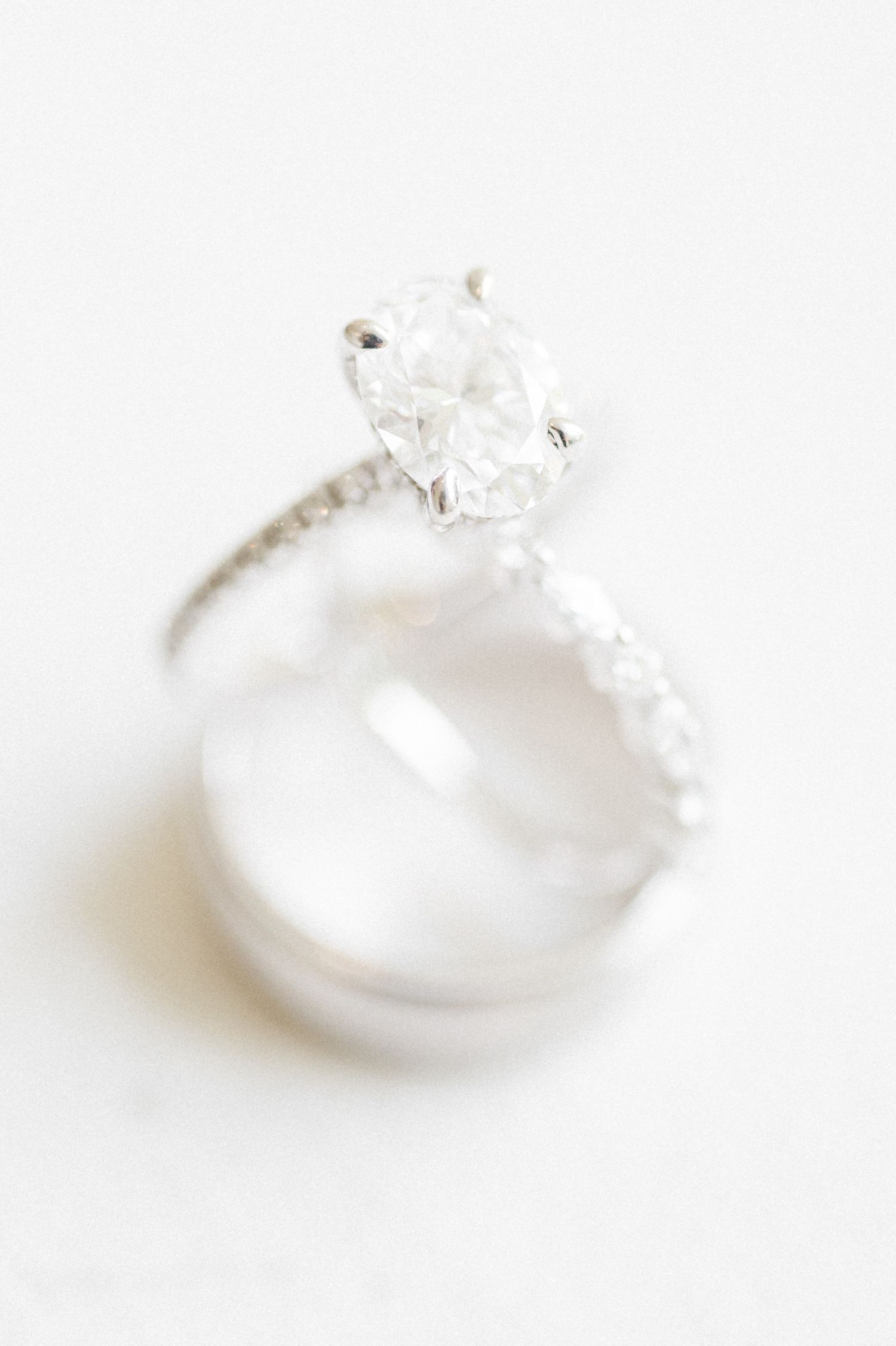 Elegant diamond engagement ring photographed on white background.