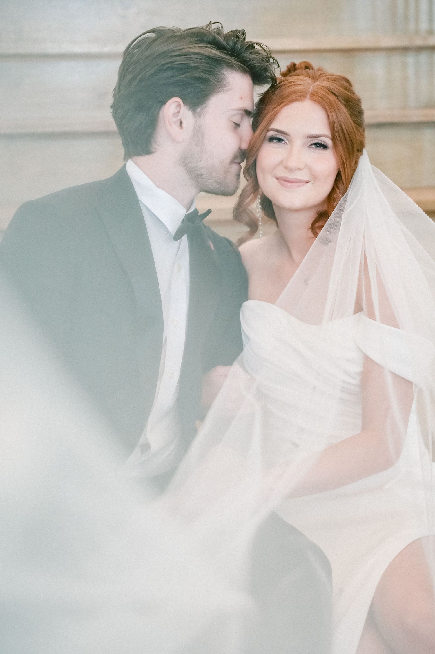 Romantic wedding moment captured through soft, ethereal photography.