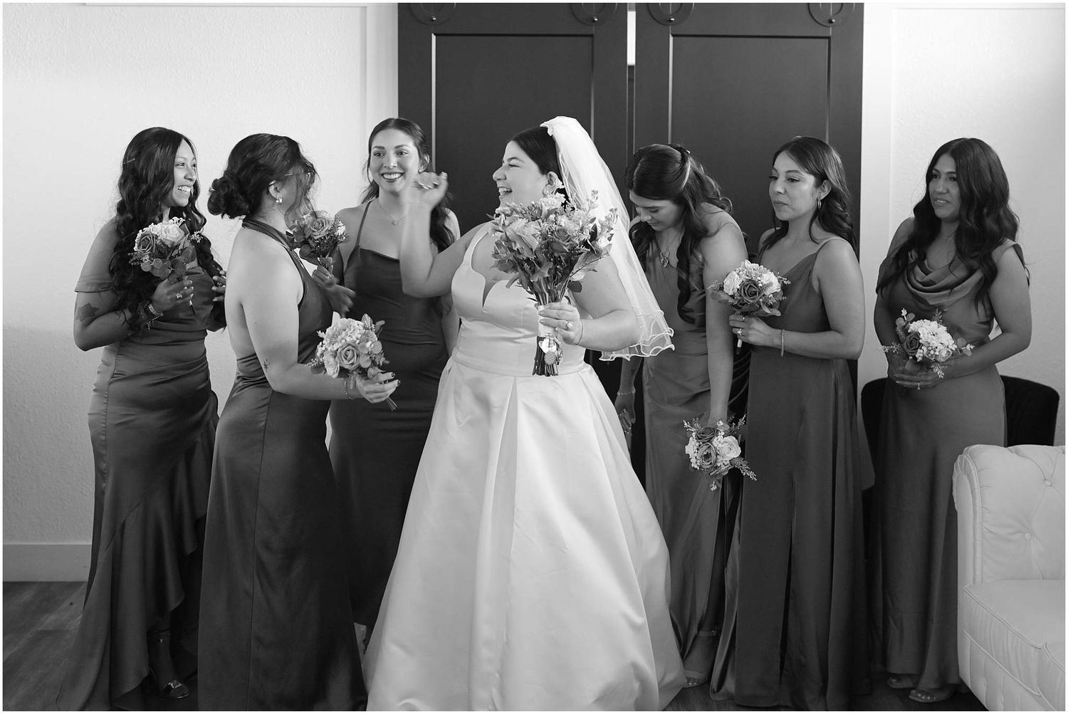 Black and white wedding party photos showing candid moments and reactions during a celebration.