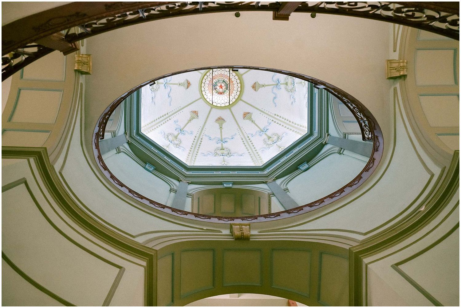 Ornate architectural details of multiple domed ceiling skylights with decorative molding in a historic building.
