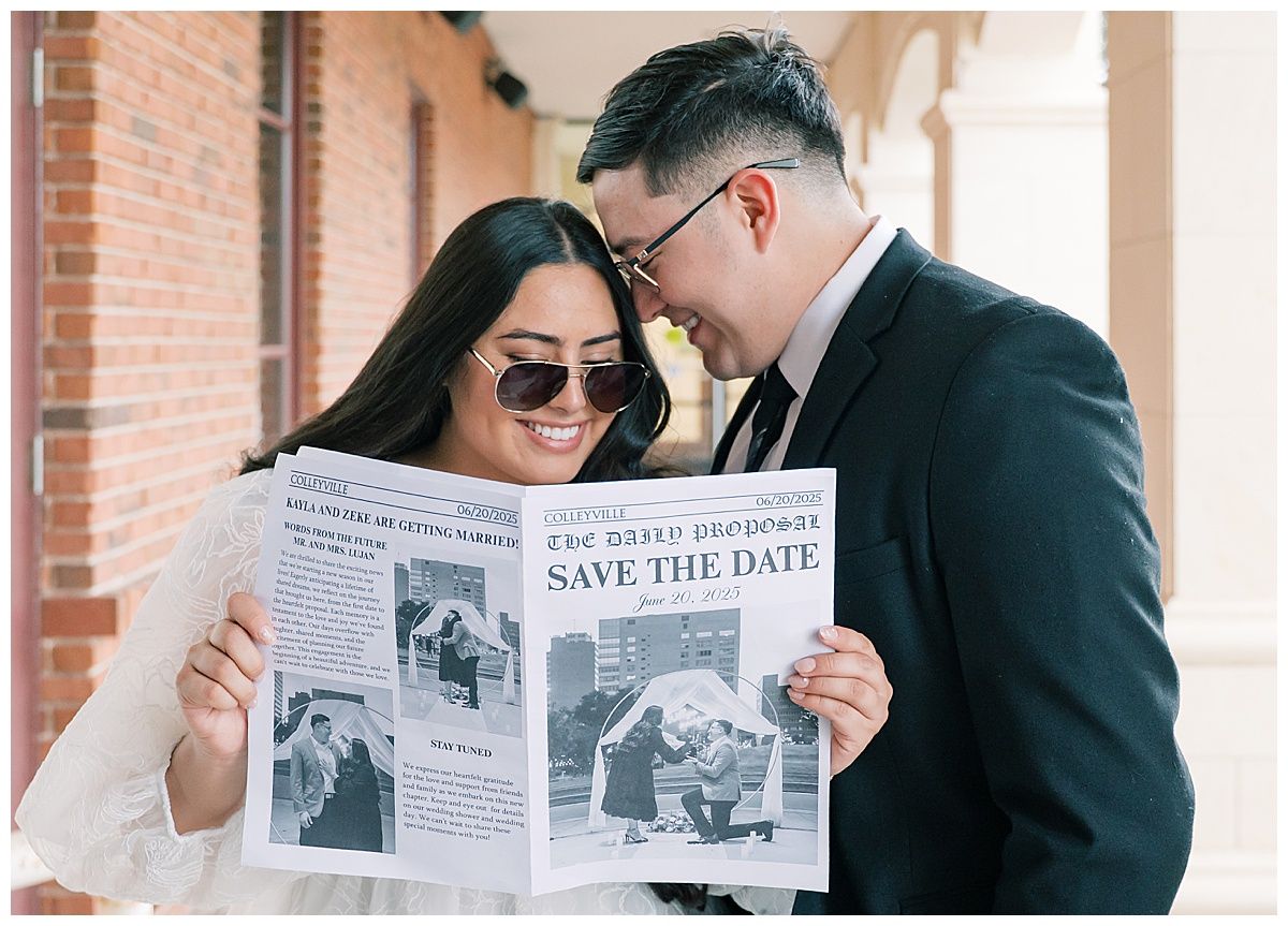 A couple reads a newspaper-style save the date announcement together.