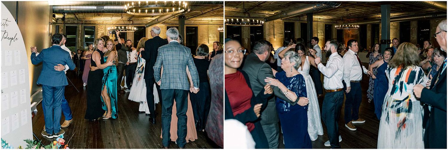 Wedding reception guests dancing and mingling in an elegant venue with warm lighting.