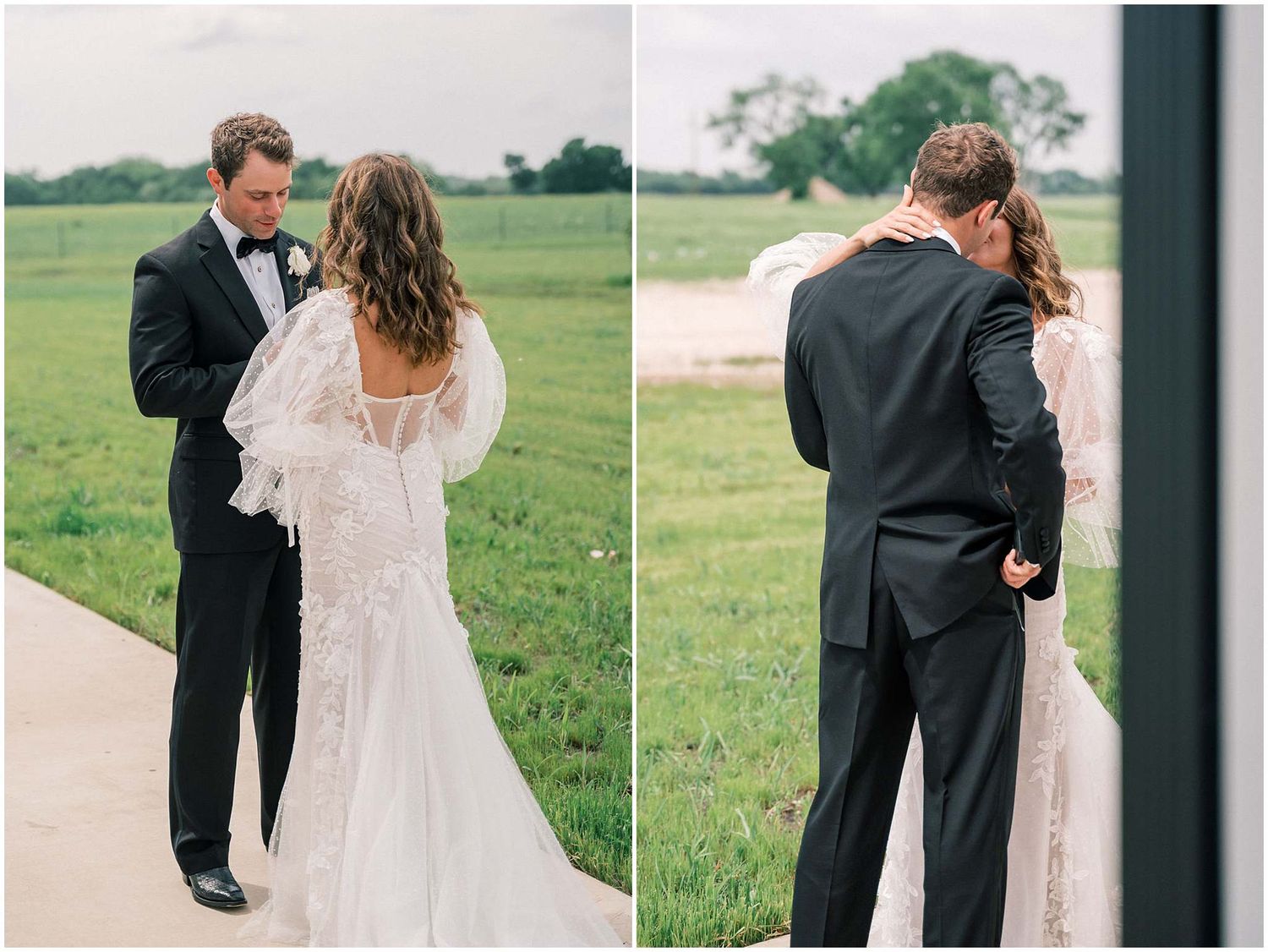 A wedding couple stands together on a pathway with green fields in the background.