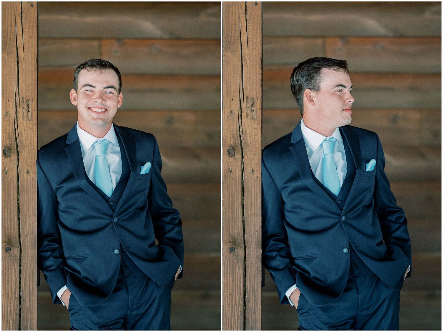 Groom in navy suit and mint tie poses playfully in rustic barn setting.