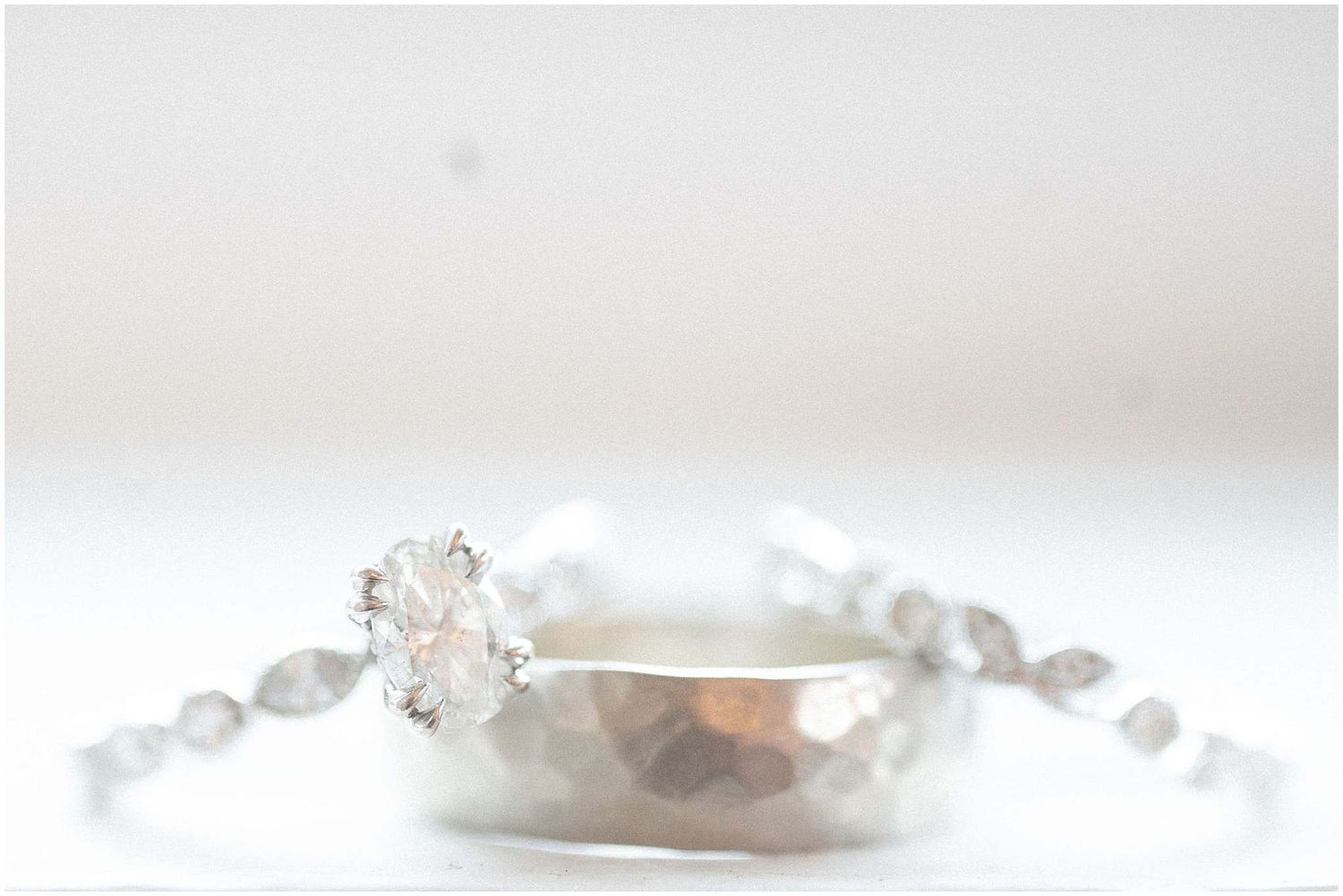 Delicate pearl and crystal bridal hair accessories arranged in an elegant display on a white surface.