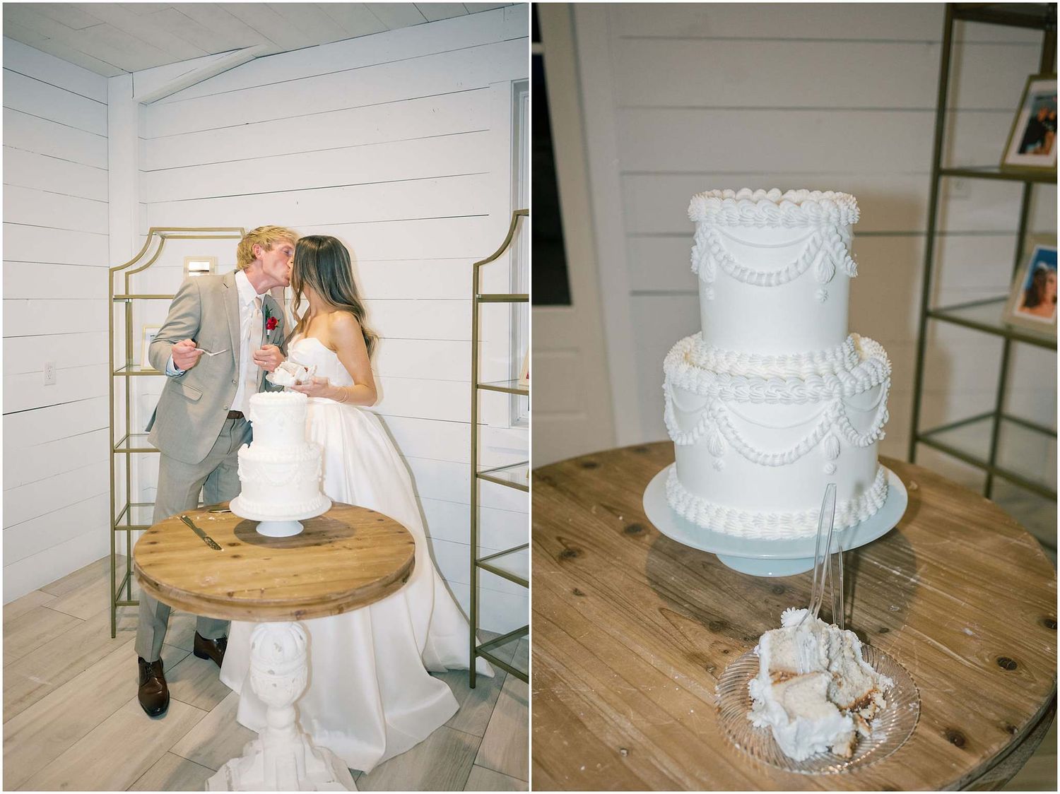 Bride and groom cutting a white tiered wedding cake on a wooden spool table beside an elegant gold display shelf.