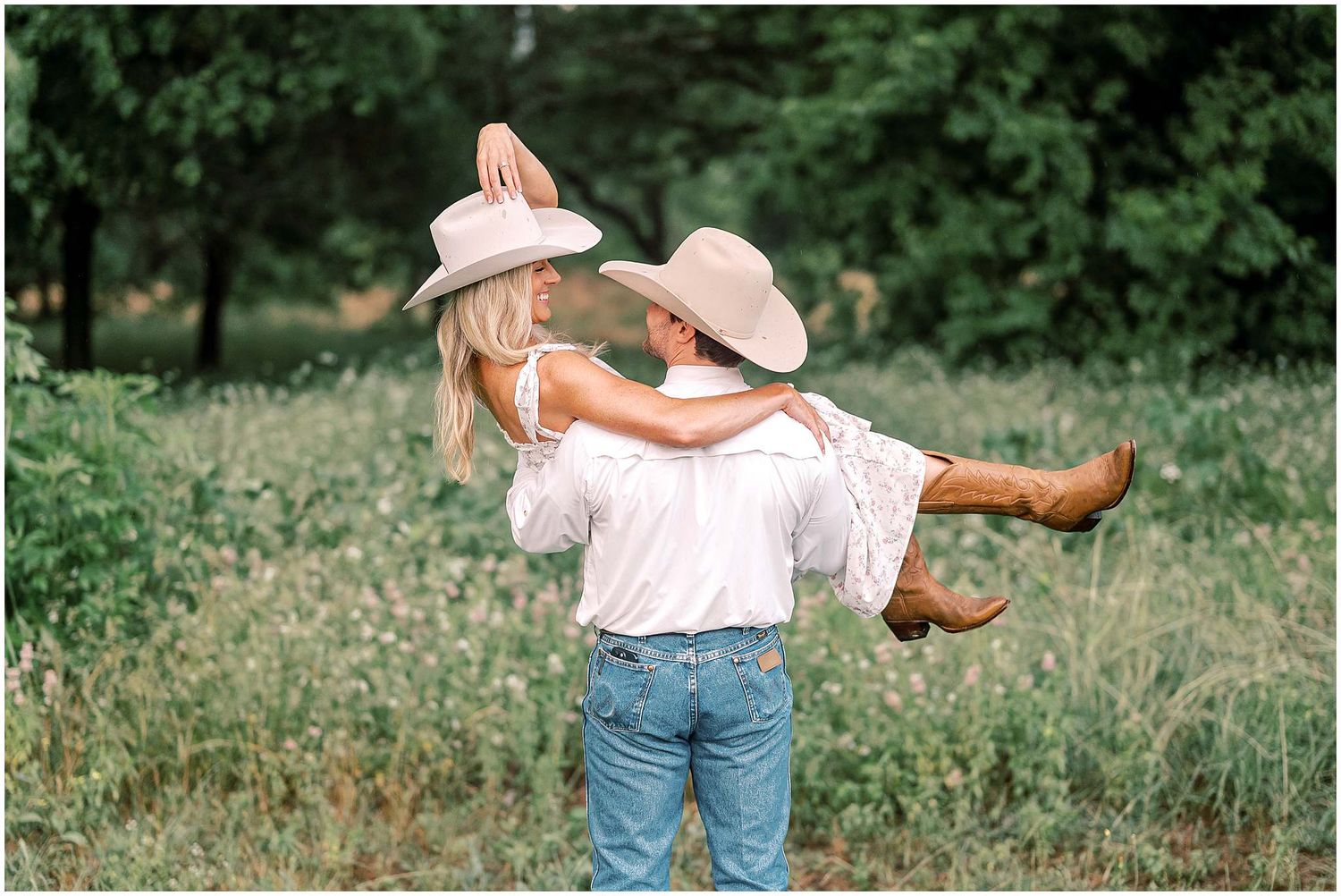Joyful dance sequence captured against a backdrop of green foliage.