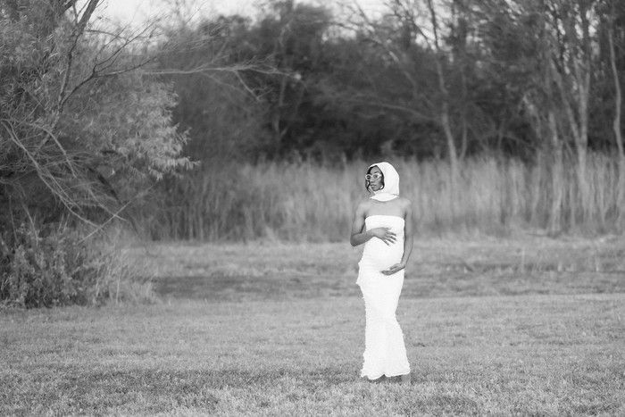 A sequence of black and white photographs showing a figure in white moving through a misty outdoor field.