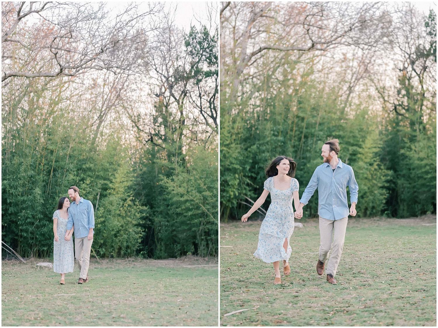 A couple walks hand in hand through a grassy field with evergreen trees in the background.