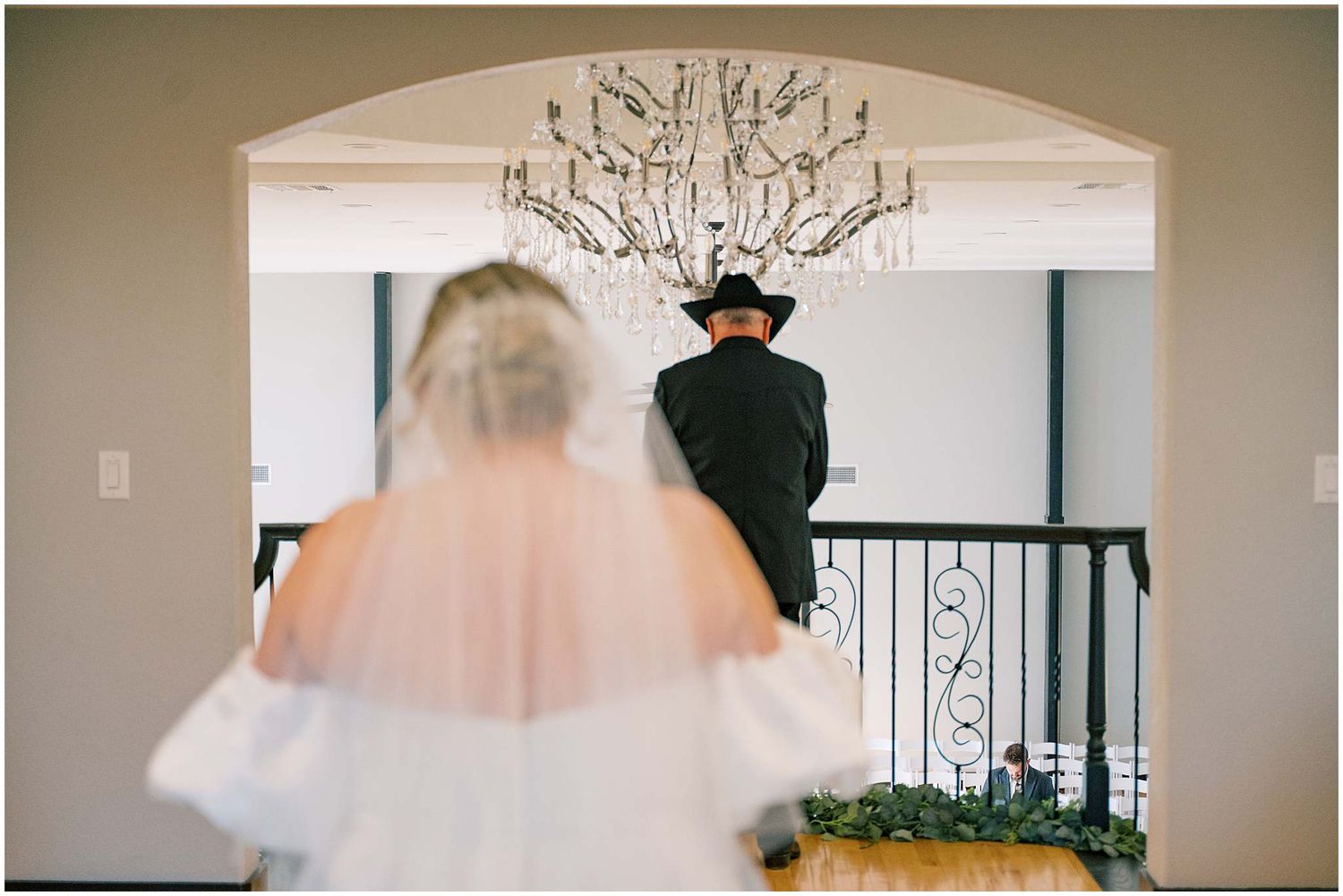 A collection of wedding photos showing a couple in an elegant venue with ornate chandeliers and arched doorways.