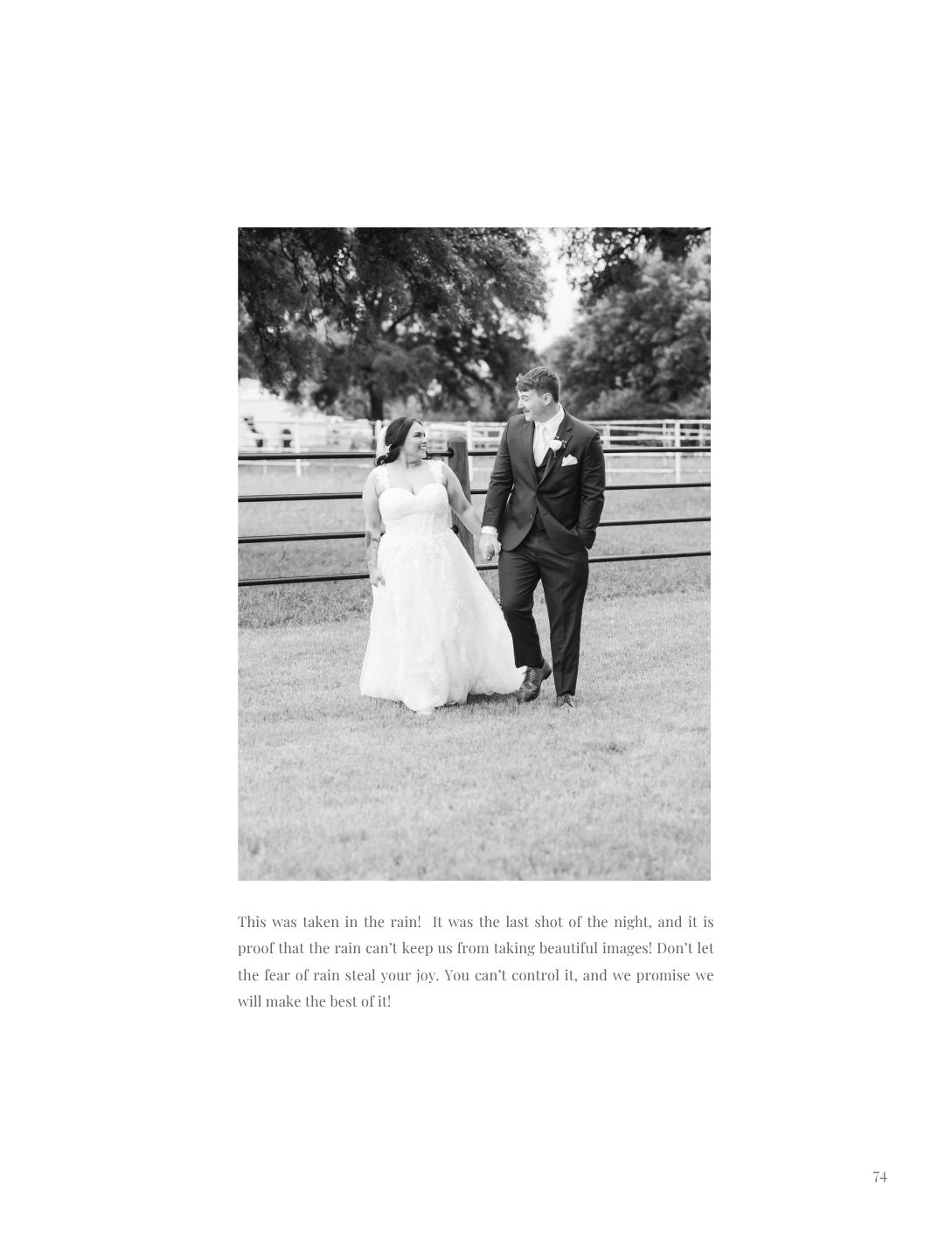 Bride and groom walking hand in hand on green lawn in black and white wedding photo taken in the rain.