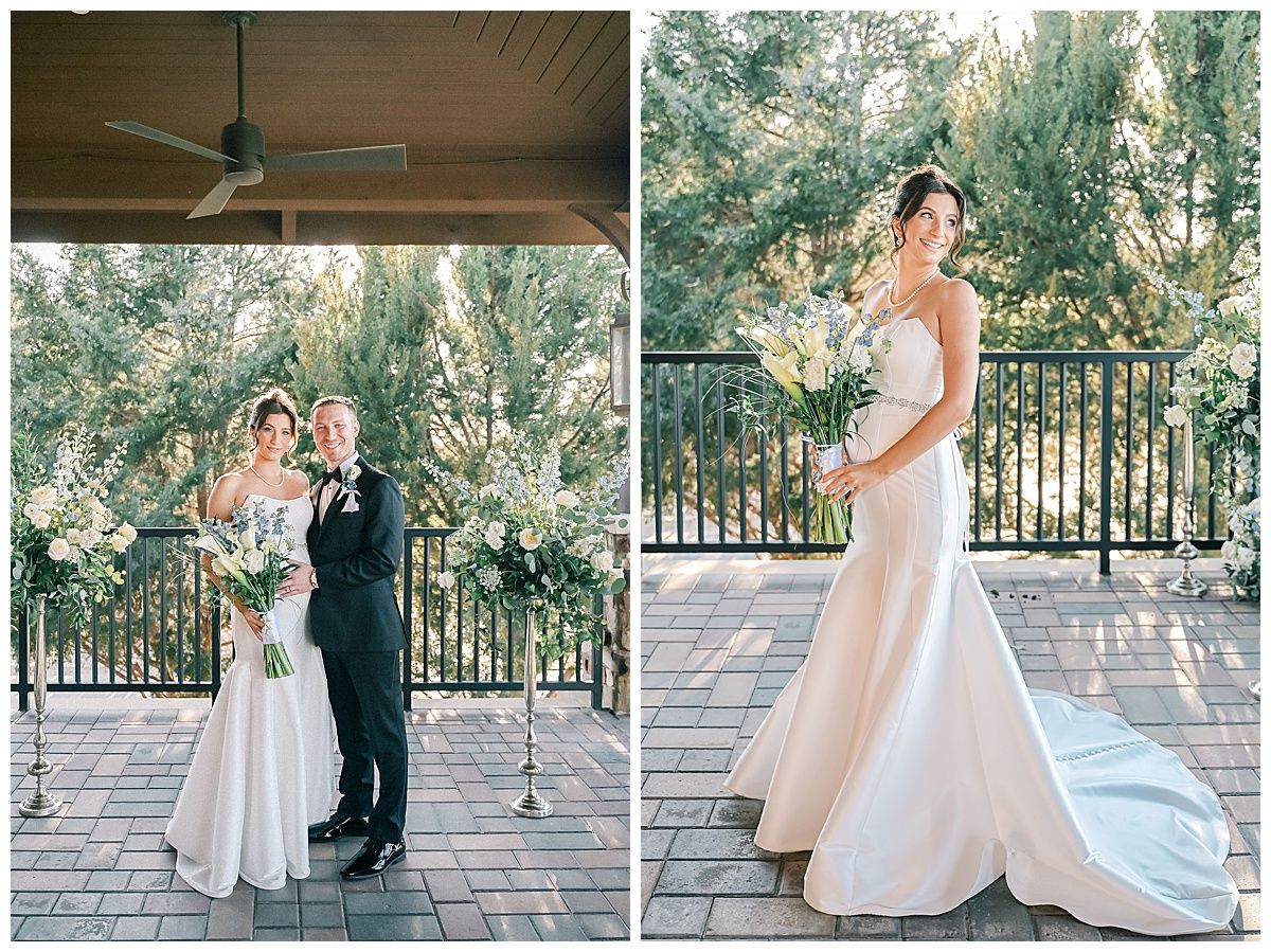 Wedding party poses on an elegant stone patio with decorative railings and lush greenery in the background.