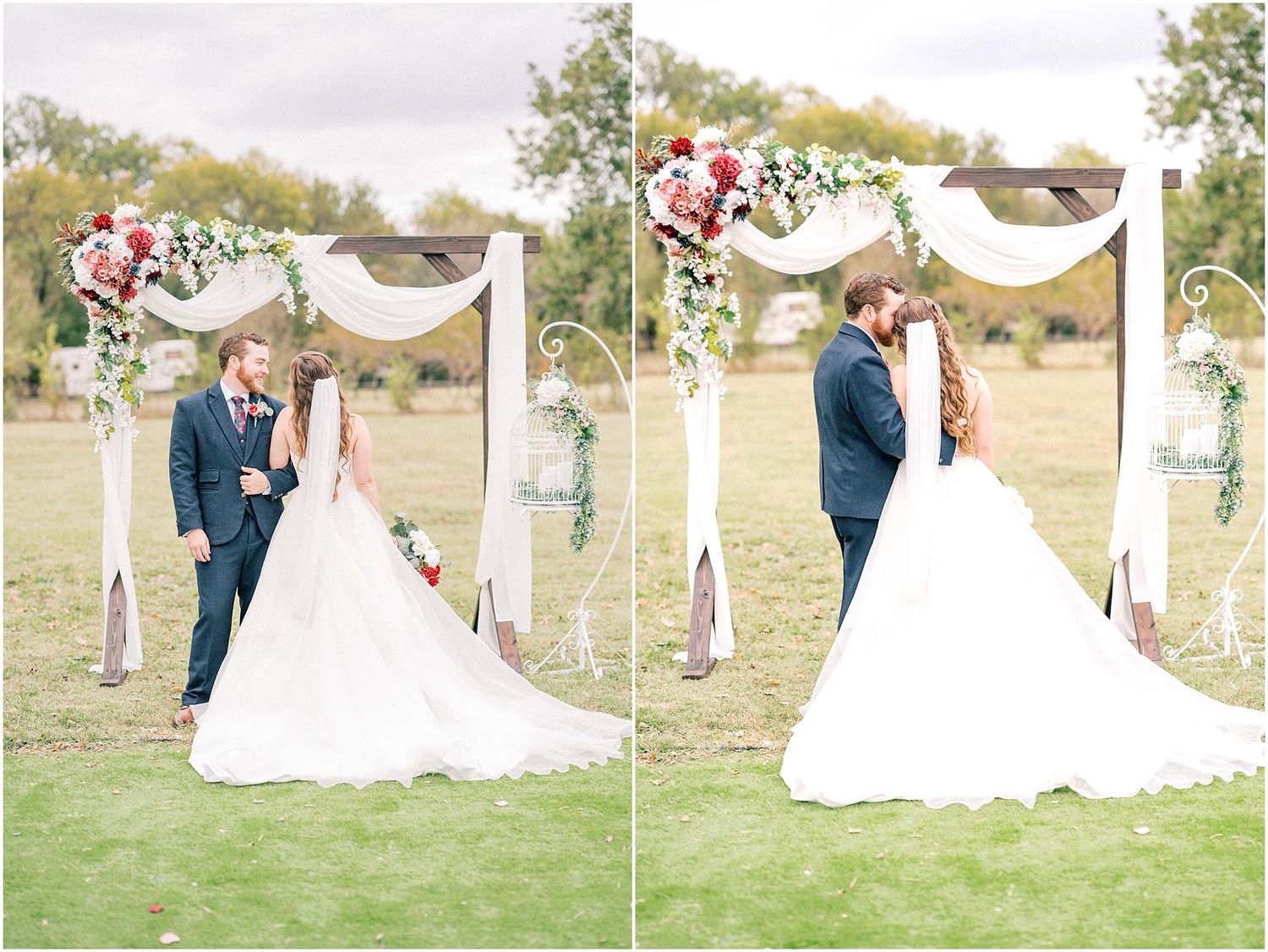 Outdoor wedding ceremony setup with flowing white fabric and floral arrangements in a field.