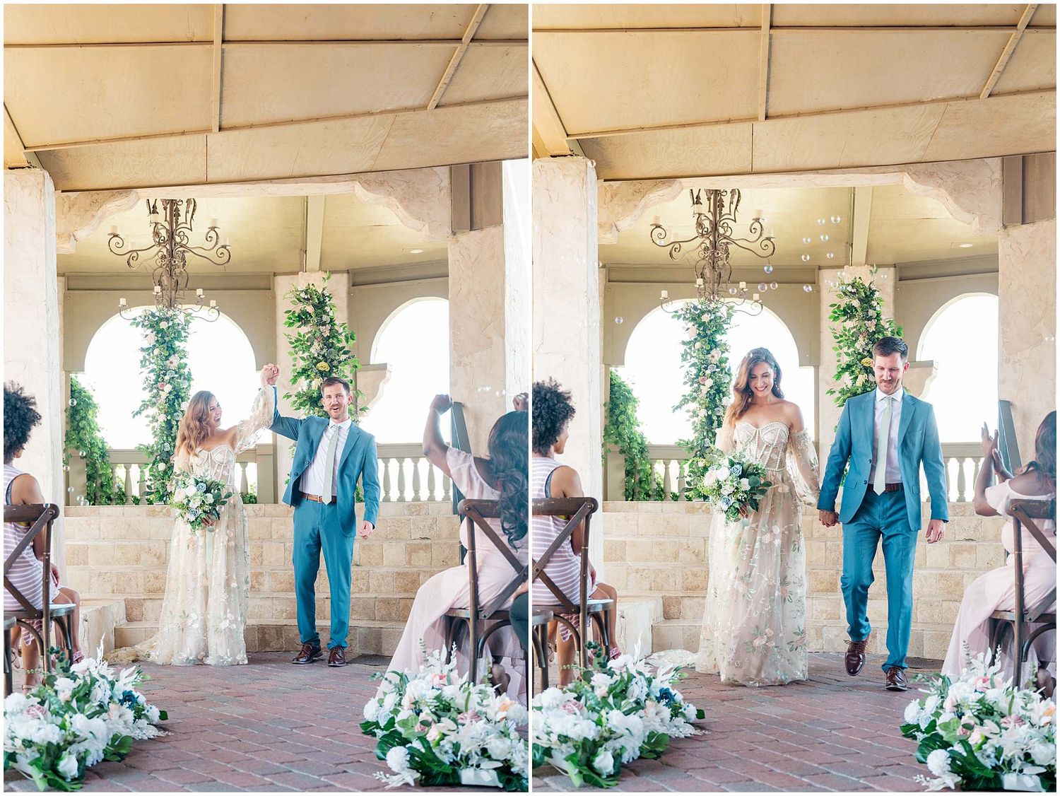 Stone archway corridor decorated with white floral arrangements and greenery for a wedding.