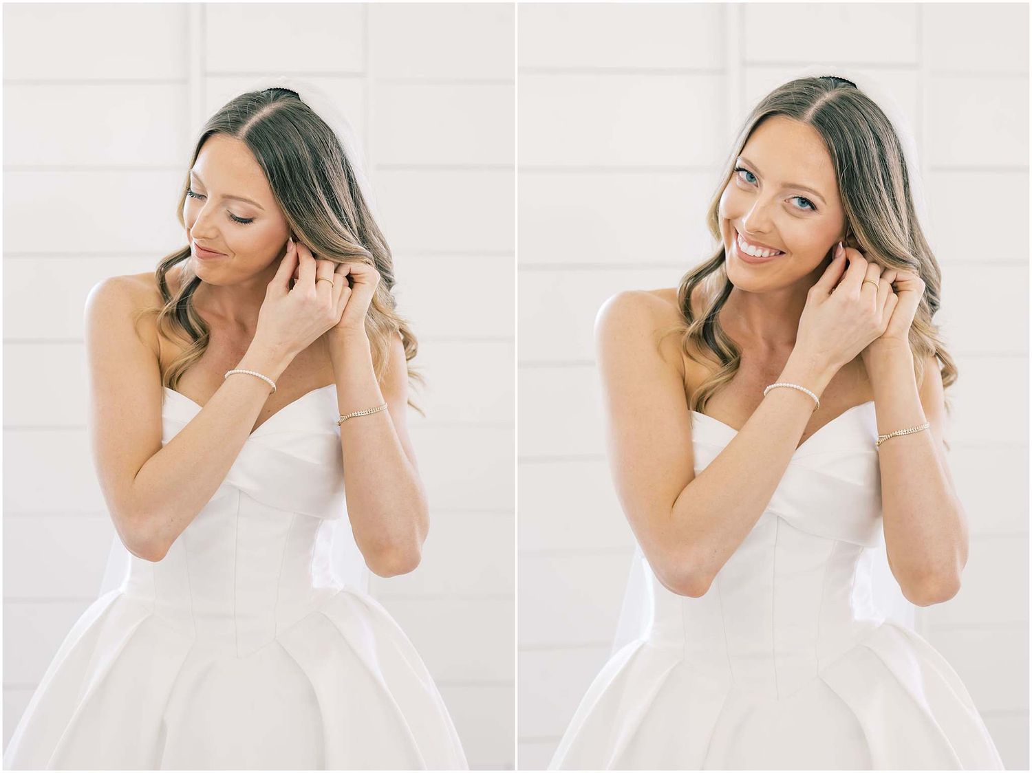 Bride in white strapless gown smiling and putting on earrings in a bright white studio setting.