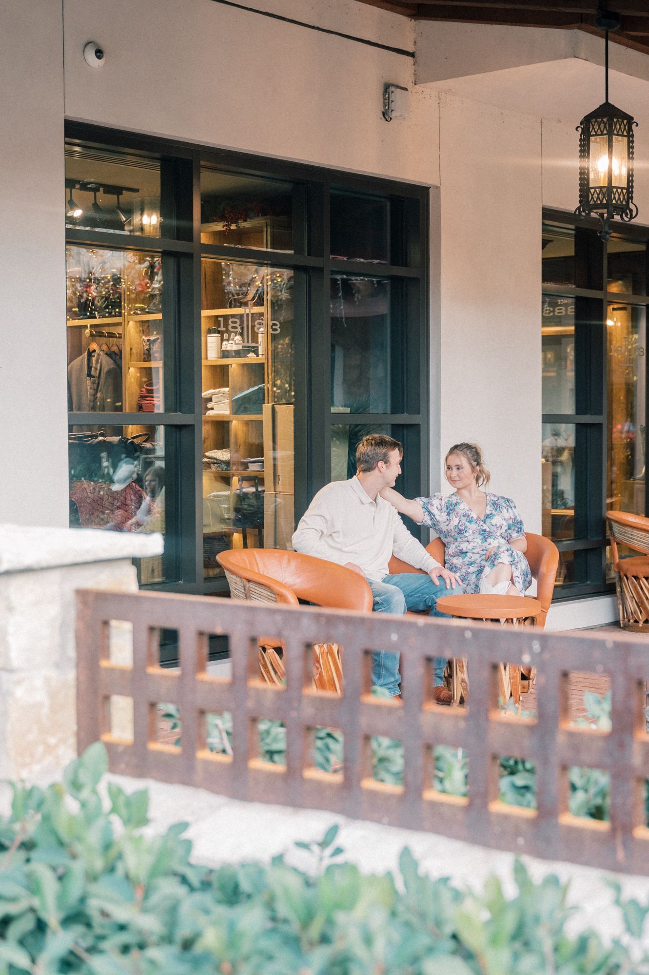A series of photos showing a couple sitting on a porch with wooden railings and greenery.