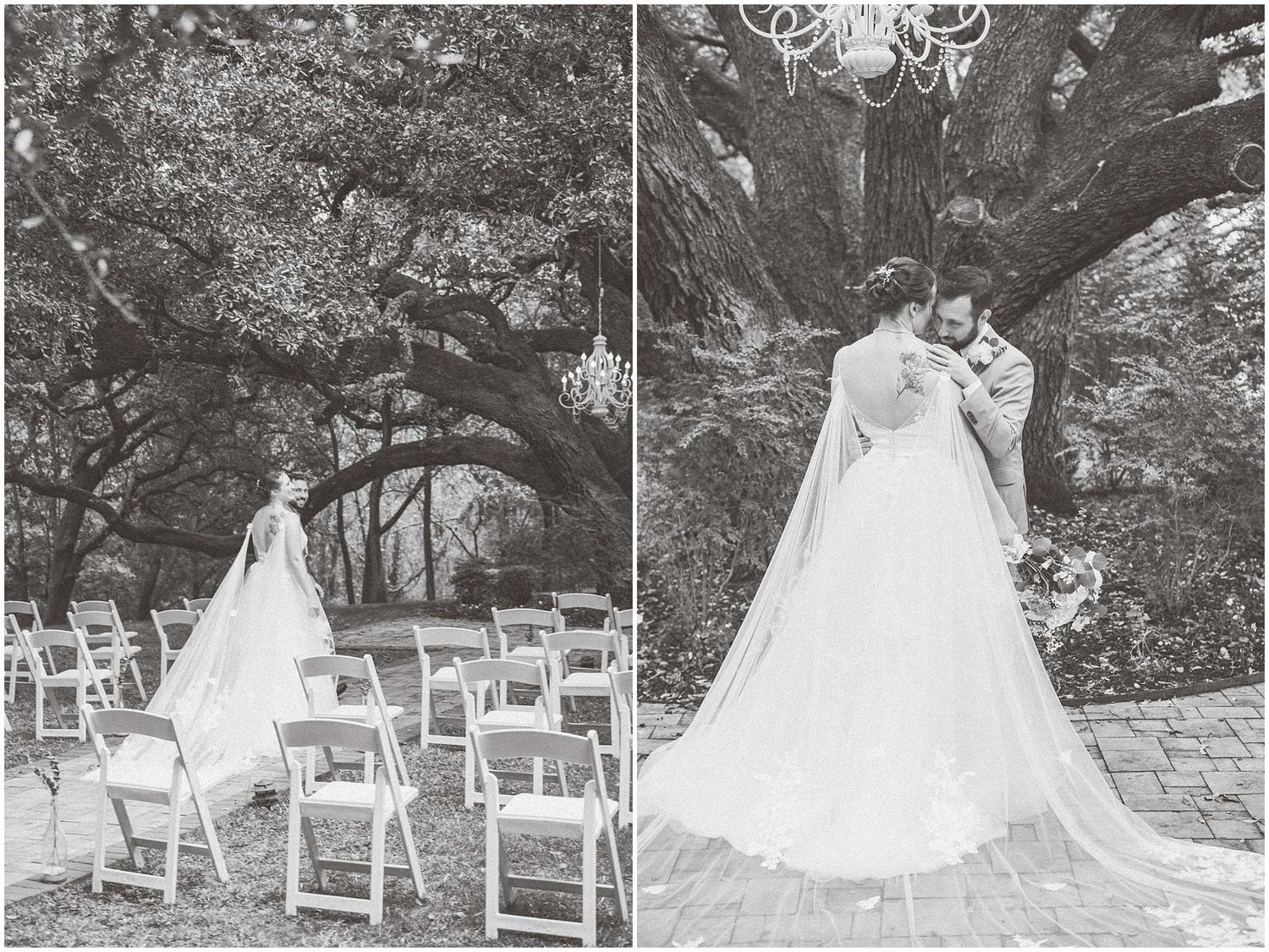 A black and white photograph of an elegant wedding scene beneath a grand oak tree with white folding chairs.