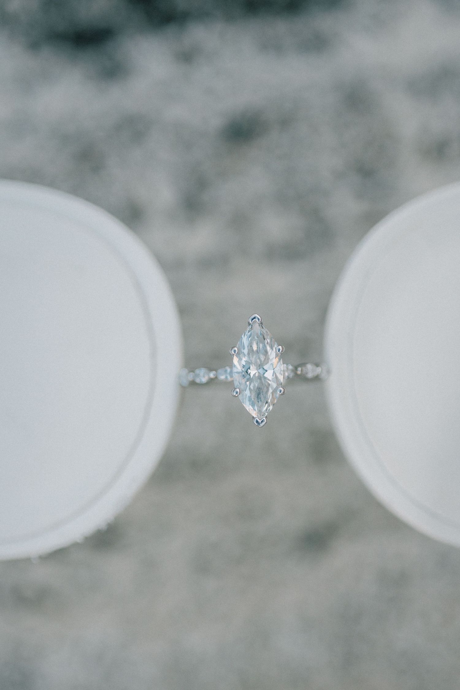 A series of close-up photos showing a sparkling oval-cut diamond engagement ring from different angles.