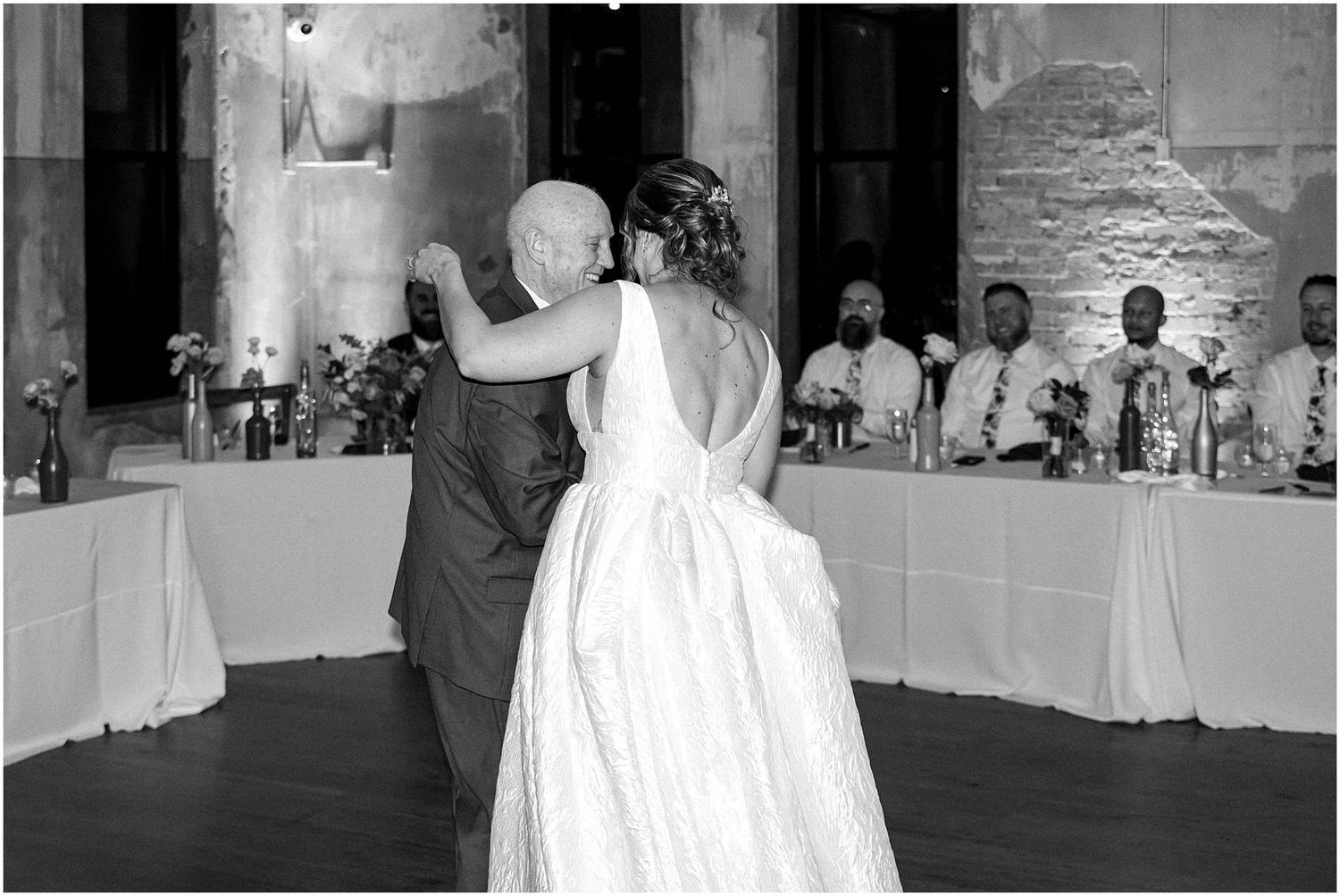Black and white photos of wedding reception moments in an elegant venue setting.