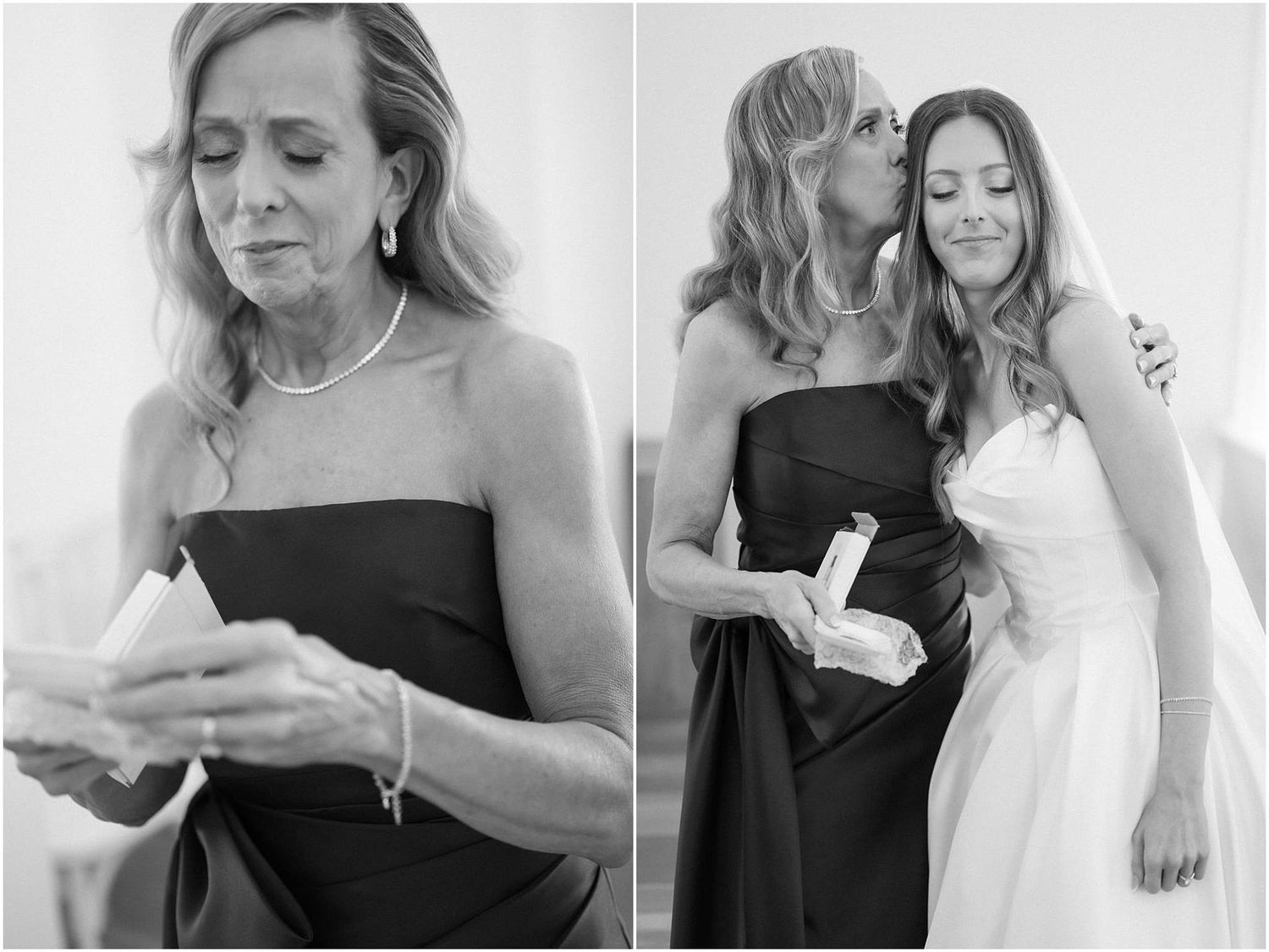Emotional mother reads heartfelt letter from bride before sharing tender hug in black and white photo.