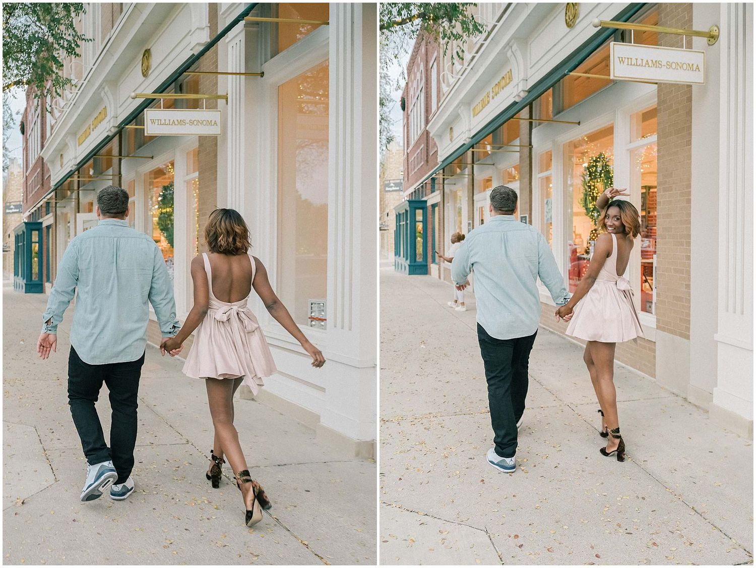 A couple strolls and poses together along a covered walkway with elegant white columns and green shutters.